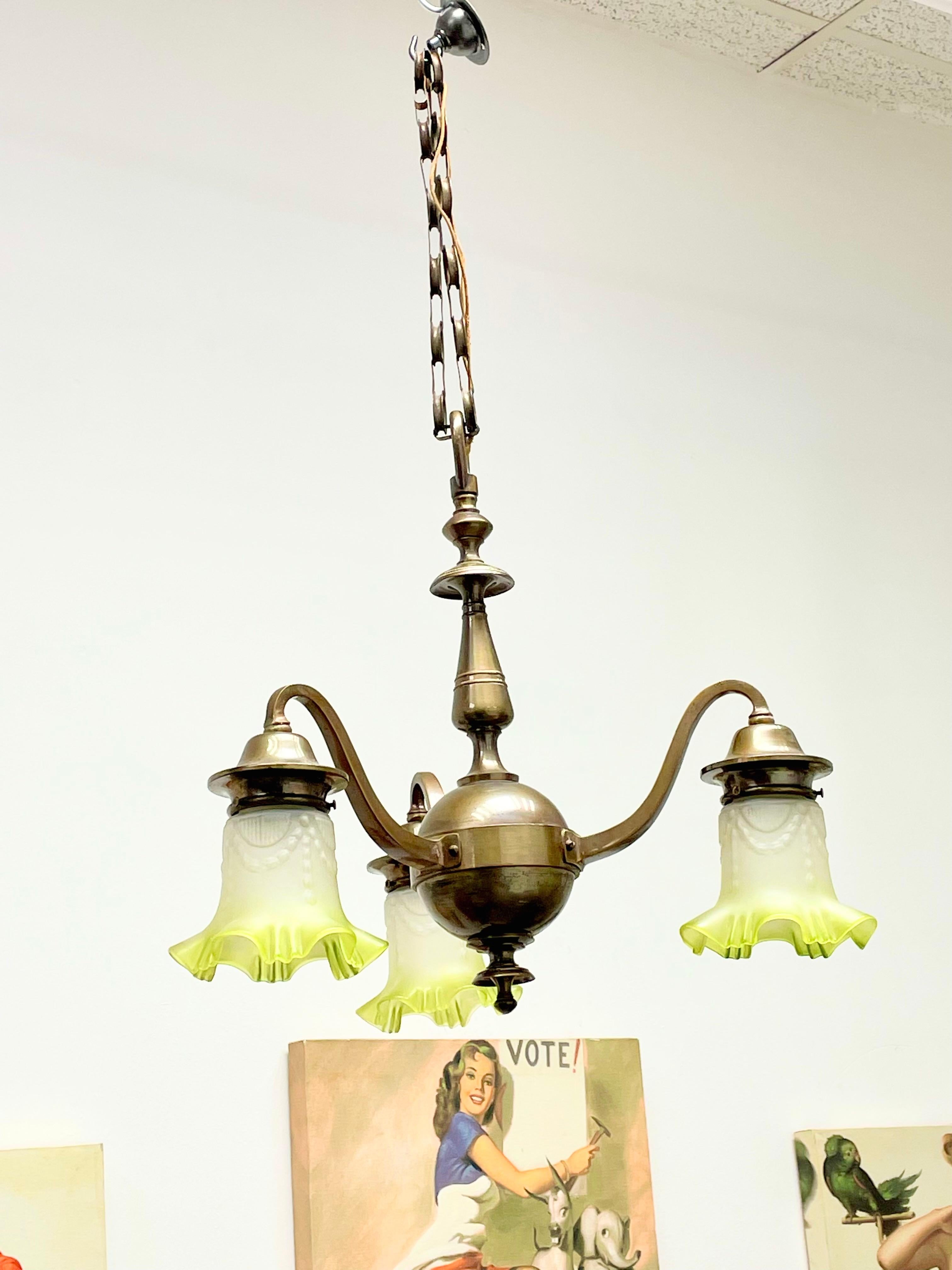 Petite Art Nouveau chandelier. Functions as is with three E27 / 110 Volt light bulbs. Can take up to 60 Watts each bulb. Beautiful bronze metal chandelier. Found at an estate sale in Vienna Austria.
It gives the room a beautiful warm light and