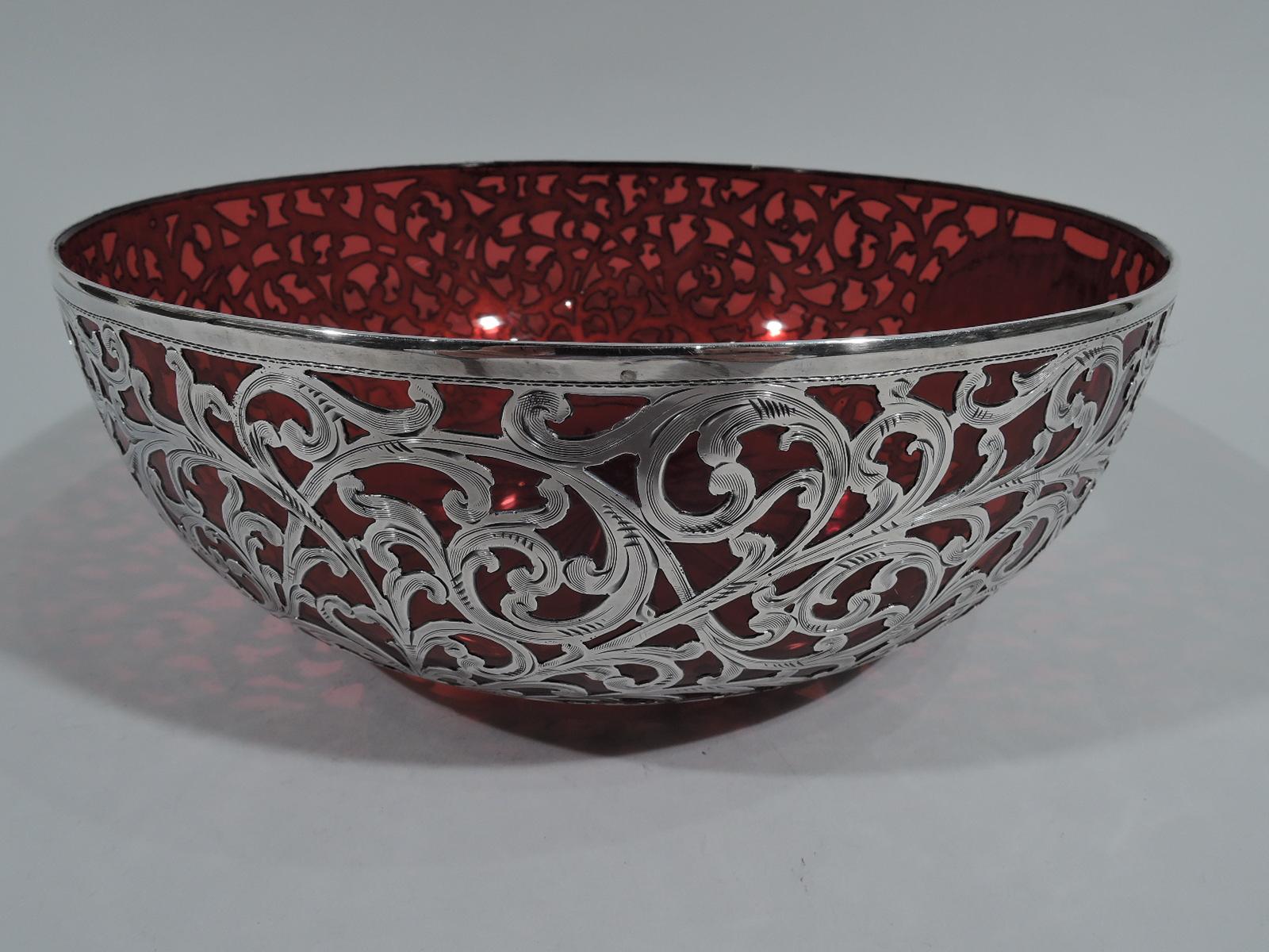 Beautiful Art Nouveau red glass bowl with silver overlay. Made by Alvin in Providence, circa 1900. Round with curved sides and star cut to underside. Engraved overlay in dense scrollwork pattern. Oval cartouche (vacant). Fully marked and numbered