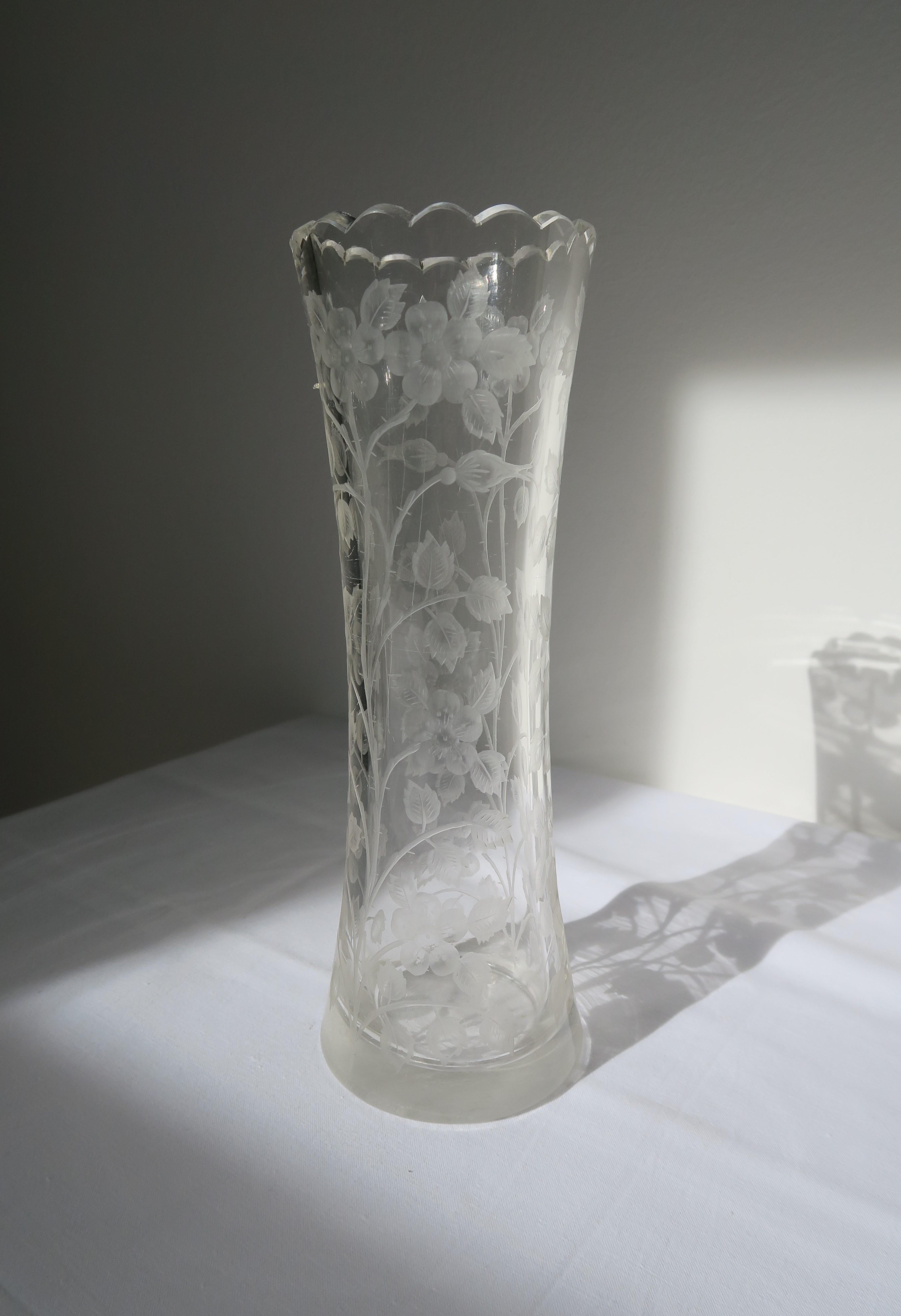 Original intricate cut glass vase by Moser Glassworks from ca. 1910-1920. Designed by renowned Karlovy Vary based designer Ludwig Moser it features a scalloped rim and beautiful rose design that has been cut into the glass catching the light in