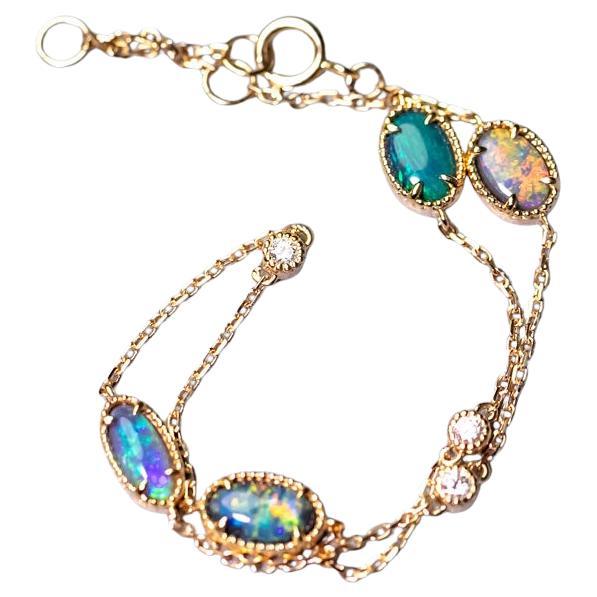 Magnifique bracelet en or jaune 18 carats avec opale noire australienne et diamants