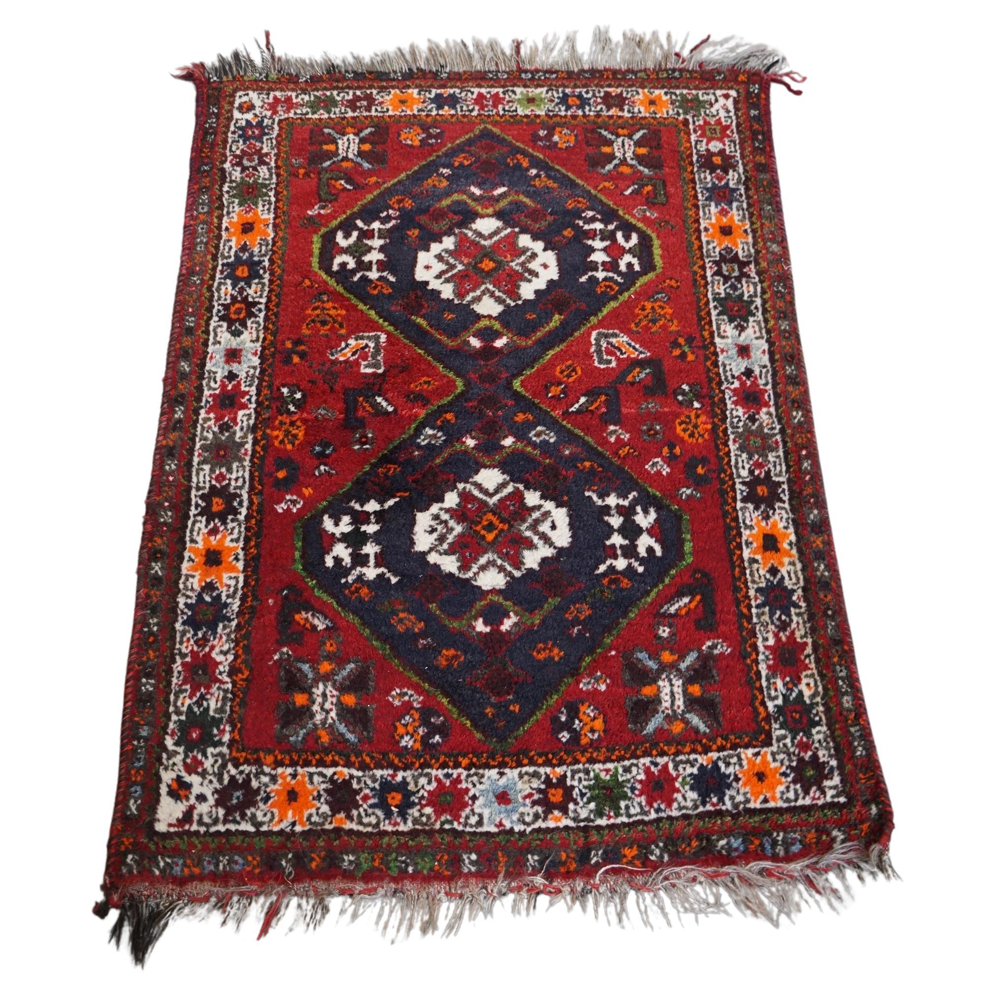 Beautiful authentic and colorful oriental rug with 2 diamond patterns 130x90cm