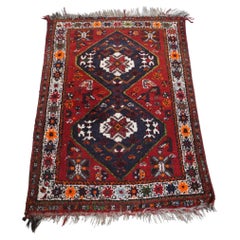 Beautiful authentic and colorful oriental rug with 2 diamond patterns 130x90cm
