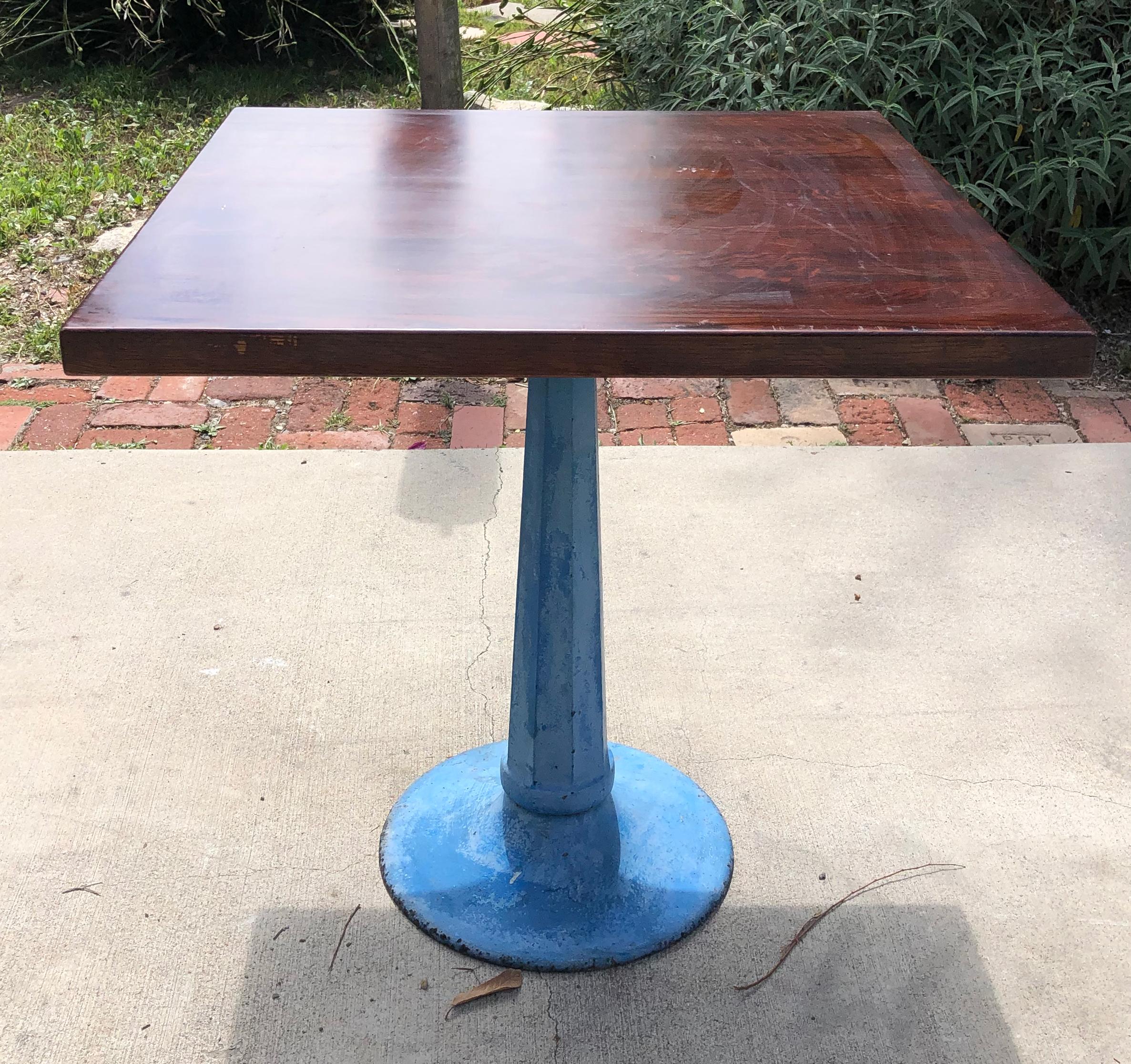This beautiful bistro style dinning table is unique as I combined an old industrial pedestal with a high quality wooden table top. the light blue paint patina on this industrial baaase gives a beautiful and delicate touch to the pieces. 