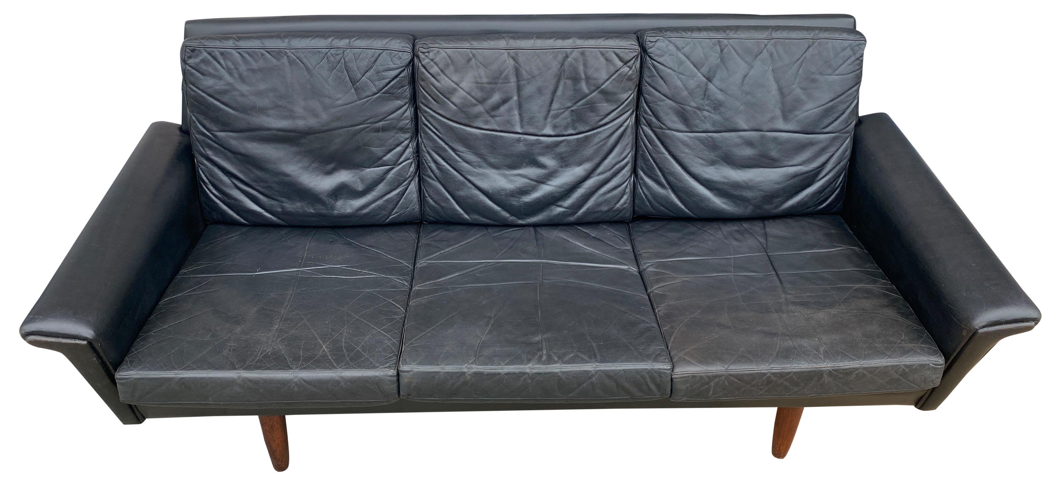 Beautiful black Leather low 3-seat Danish modern couch sofa with rosewood legs. Amazing black soft leather. Original beautiful soft black leather worn in perfectly. Original vintage condition. All cushions are removable legs unscrew. no label - Made