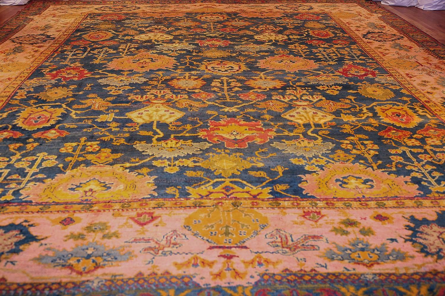 Beautiful Blue Background Antique Turkish Oushak Rug. Size: 14 ft 3 in x 19 ft  In Excellent Condition In New York, NY