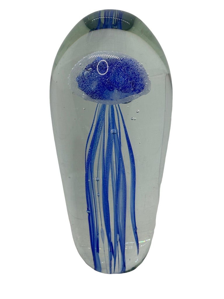 Beautiful Murano hand blown aquarium Italian art glass paper weight. Showing a blue jelly fish inside, floating on controlled bubbles. Colors are a blue and clear. A beautiful nice addition to your desktop or as a sculpture in any room.