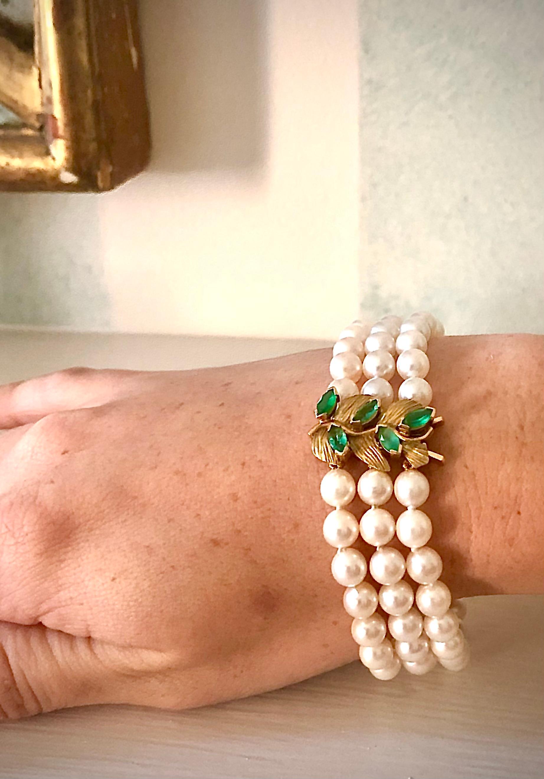 Beautiful, substantial bracelet with three rows of exceptionally lustrous nice round high quality cultured pearls. The pearls average 6.35mm in diameter. There are two relatively heavy gold divider bars.

The clasp is very nicely crafted with matte