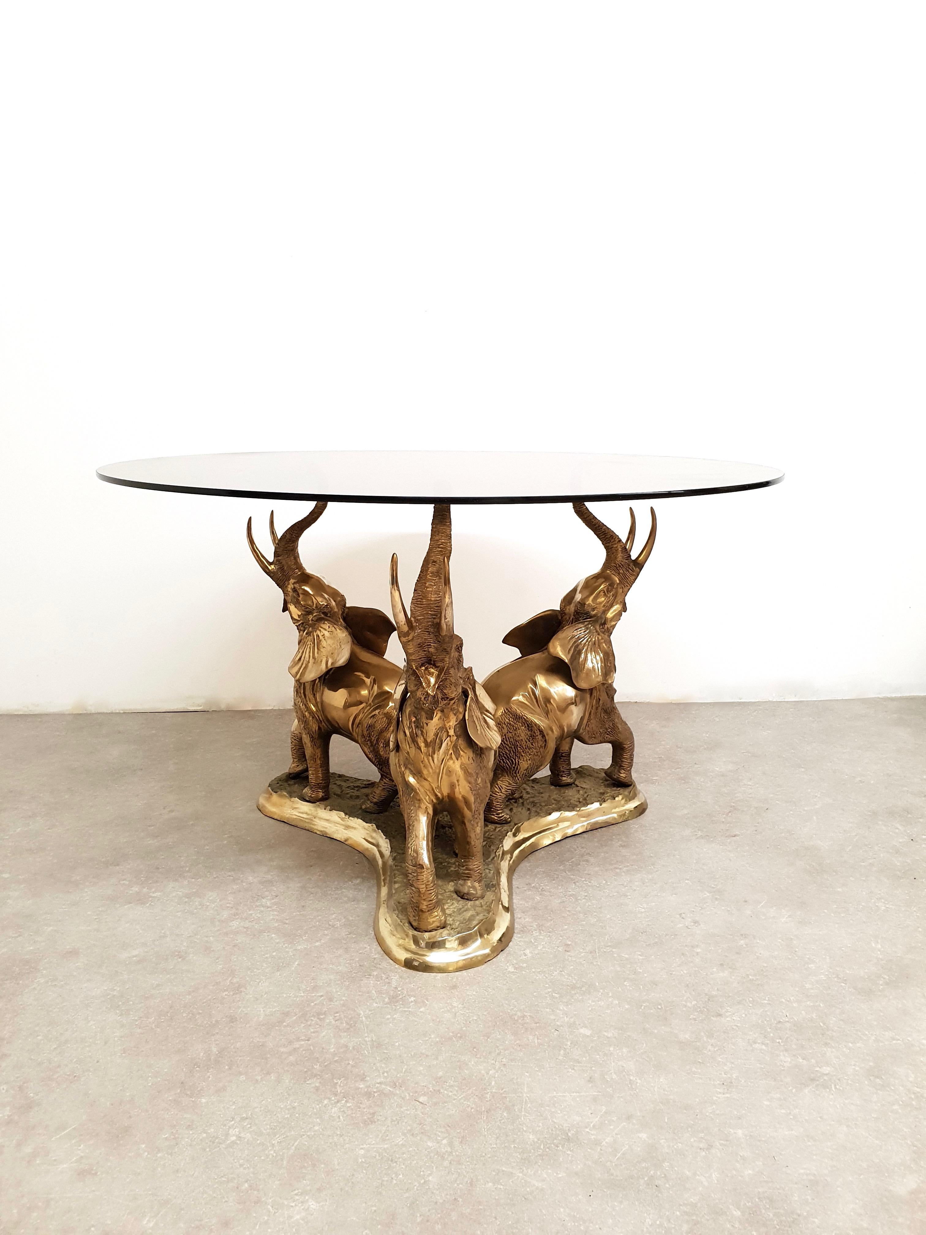 elephant dining table with glass top