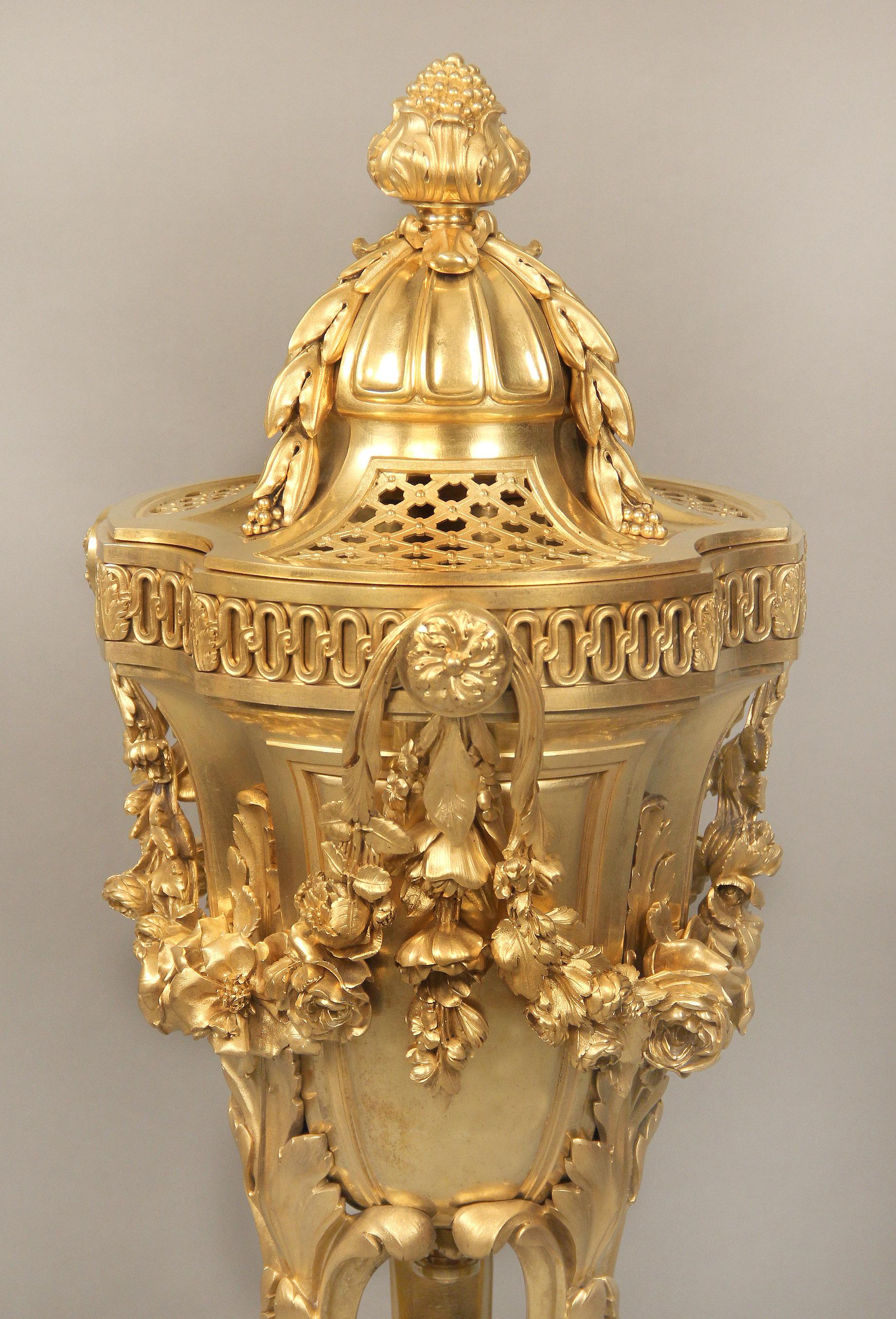  A Late 19th Century Louis XV Style Gilt Bronze Brule Parfum

Made entirely of gilded bronze with carvings of berries, flowers and foliage. With a separate top and standing upon lion paw feet.