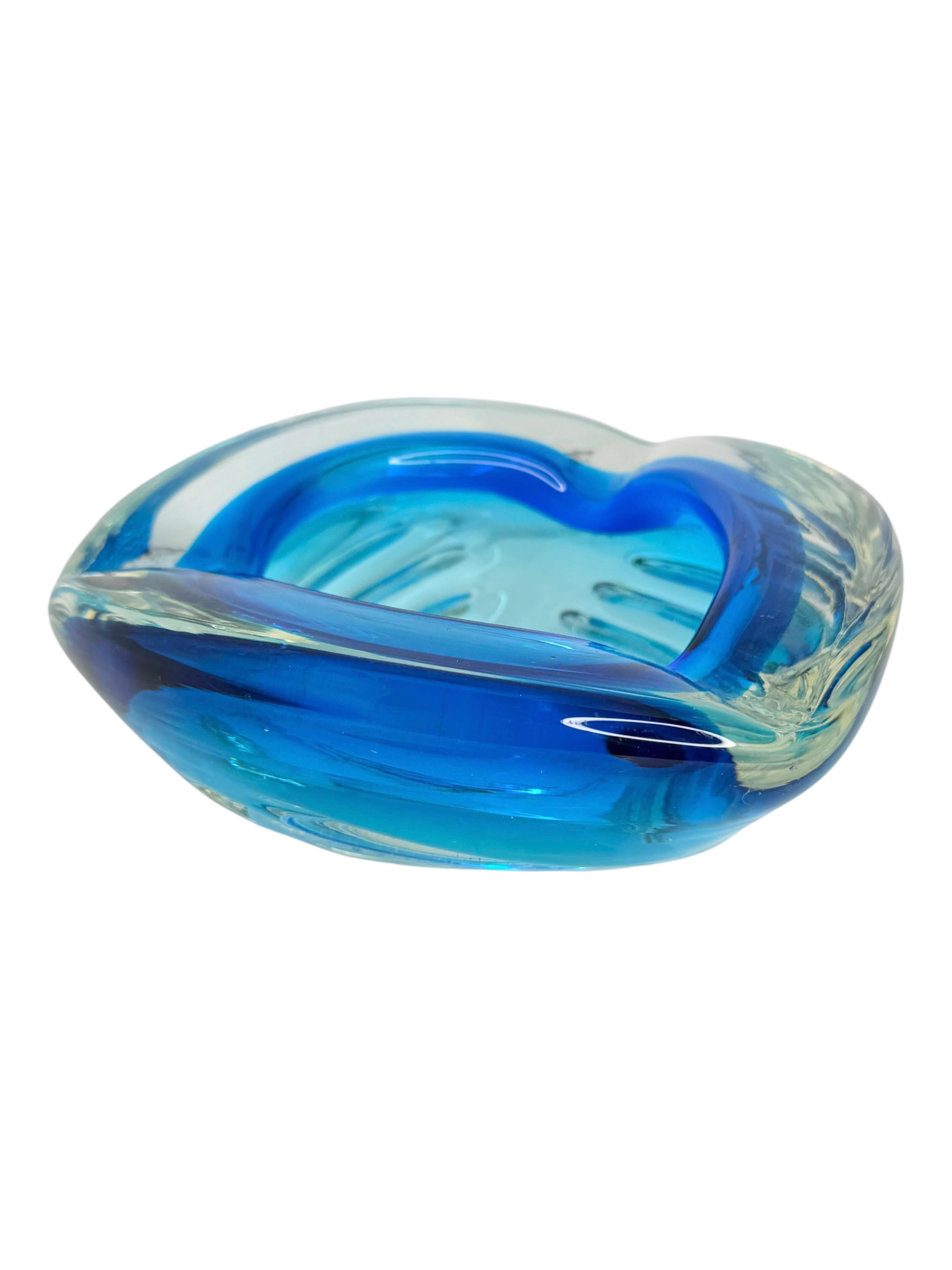 Gorgeous large heavy hand blown Murano art glass piece. A beautiful brutalist and organic ashtray, Venice, Murano, Italy, 1970s. Colors are Blue and clear glass, with controlled lines on the outside. Found at an estate sale in Modena, Italy. Nice