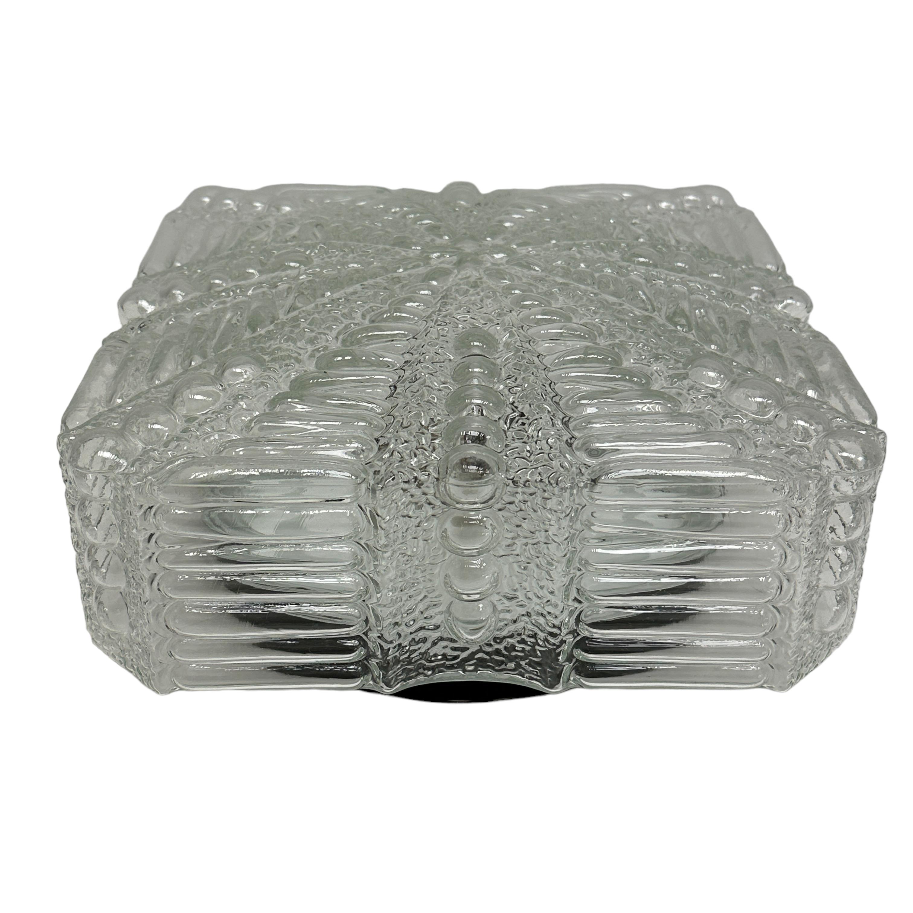 Beautiful Bubble and star pattern clear glass flush mount. Made in Germany by RZB Leuchten. Gorgeous textured glass flush mount with metal fixture. The Fixture requires one European E27/110 Volt Edison bulb, up to 60 watts. A nice addition to any