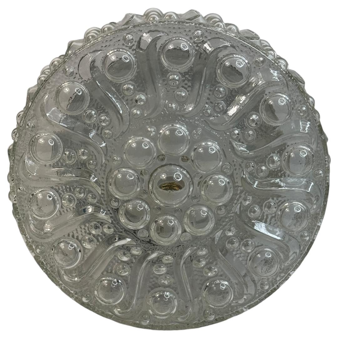 Beautiful bubble pattern flush mount. Made in Germany by Glashuette Limburg. Gorgeous textured glass flush mount with metal fixture. The fixture requires one European E27 Edison bulb up to 60 watts.
Found at an Estate Sale in Nuremberg, Germany. A