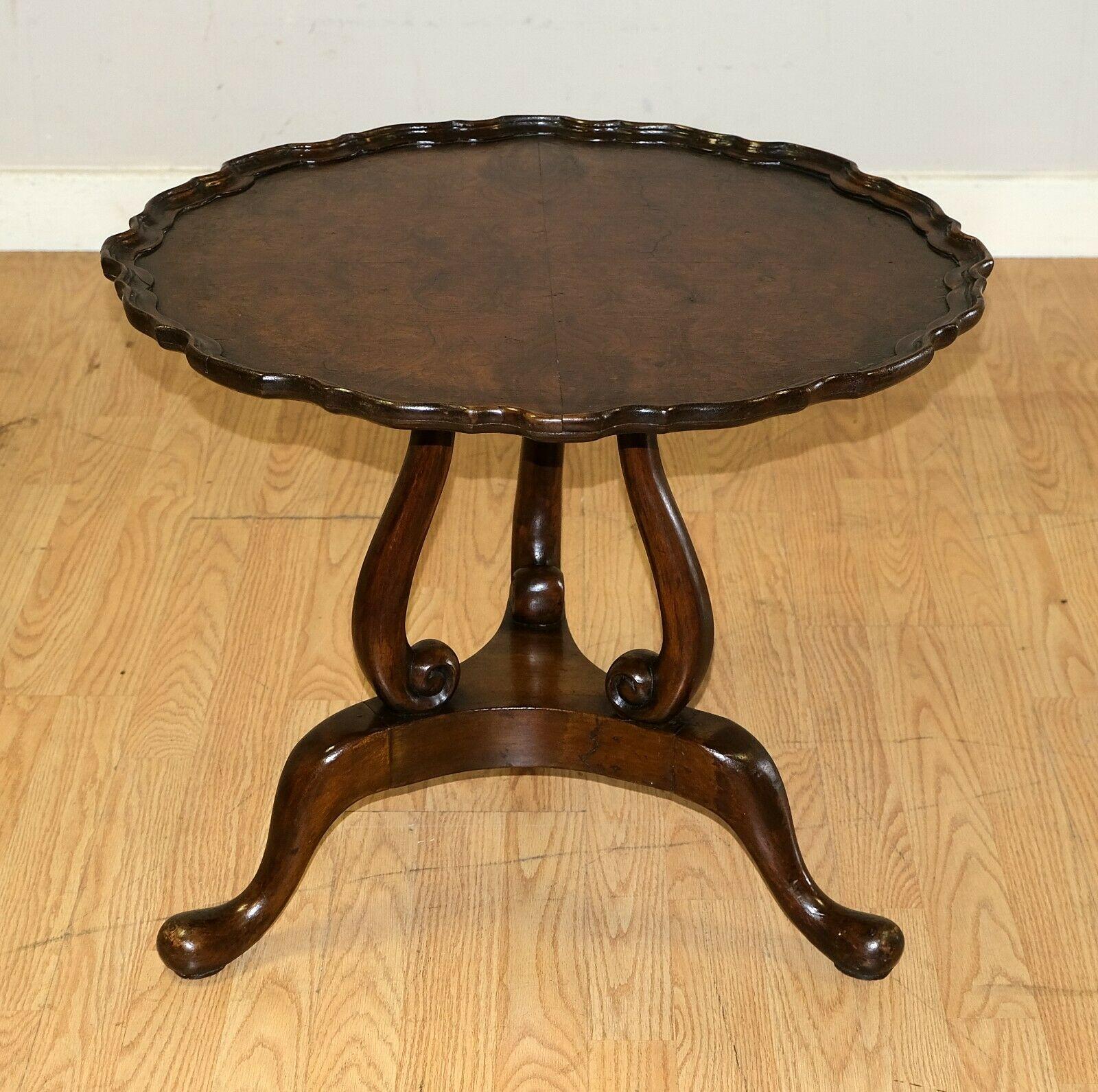 We are delighted to offer for sale this lovely Burr Walnut tripod side, end, wine table.

The item is just charming from any angle that you look at it. First the piecrust edge is presented with very soft lines and the design of the support makes