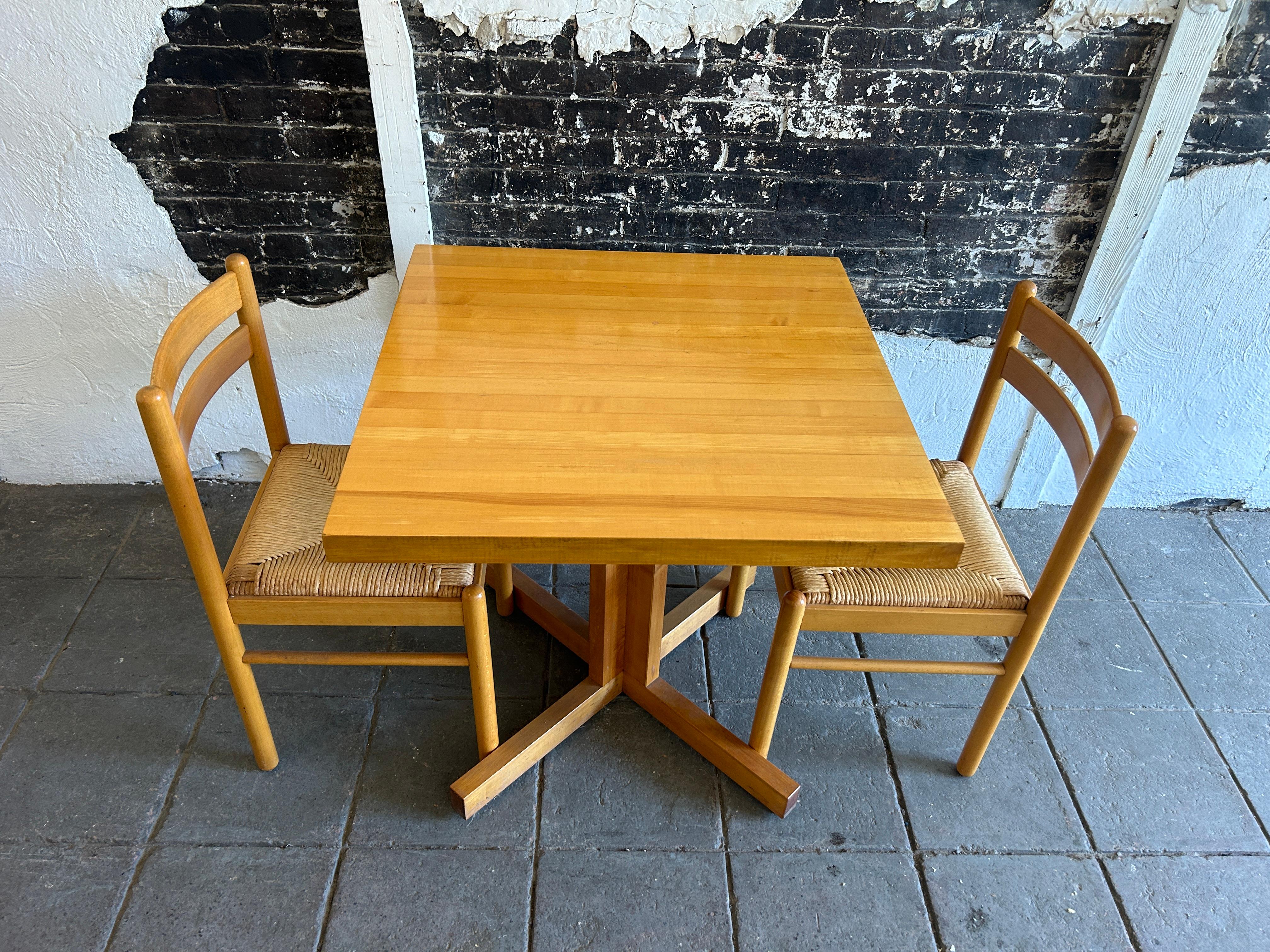 Beautiful butcher block dinette table set with pair of Birch Rush chairs Italy. Very clean small dining table with (2) paper cord birch wood post modern design chairs made in Italy. Chairs are labeled made in Italy. Table is a solid maple butcher