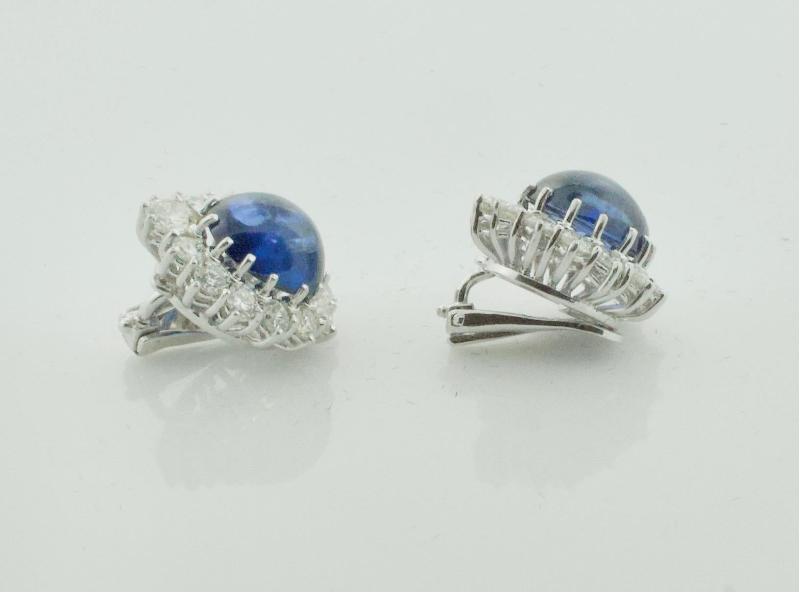 Beautiful Cabochon Sapphire and Diamond Clip Earrings in Platinum
Two Cabochon Sapphires weigh 15.00 carats [bright with no imperfections visible to the naked eye]
Two Round Brilliant Cut Diamonds weighing .65 carats approximately
Twenty Four Round