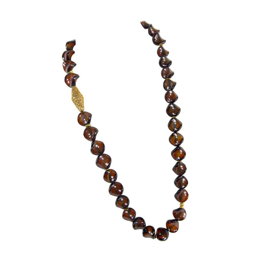 Stunning and Unique Large ‘Thump Grip’ Carnelian and Gold bead Runway Necklace. Approx. length of necklace 32 inches; enhanced an embossed tubular shaped gilt brass bead; approx. 42.5mm long x 17mm wide; 38 Carnelian beads; each approx. 22mm in