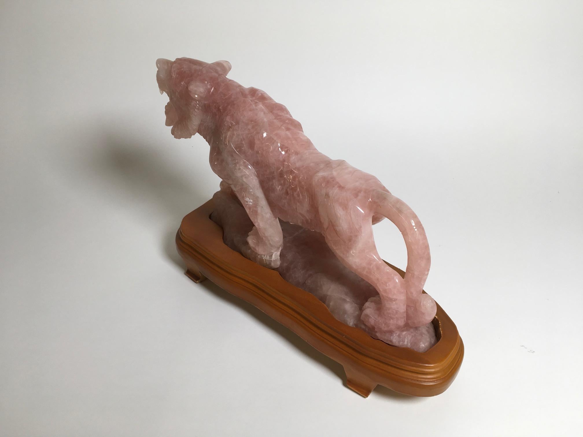 Beautiful carved rose quartz sculpture with wooden base produced in China. Italian Private collection.