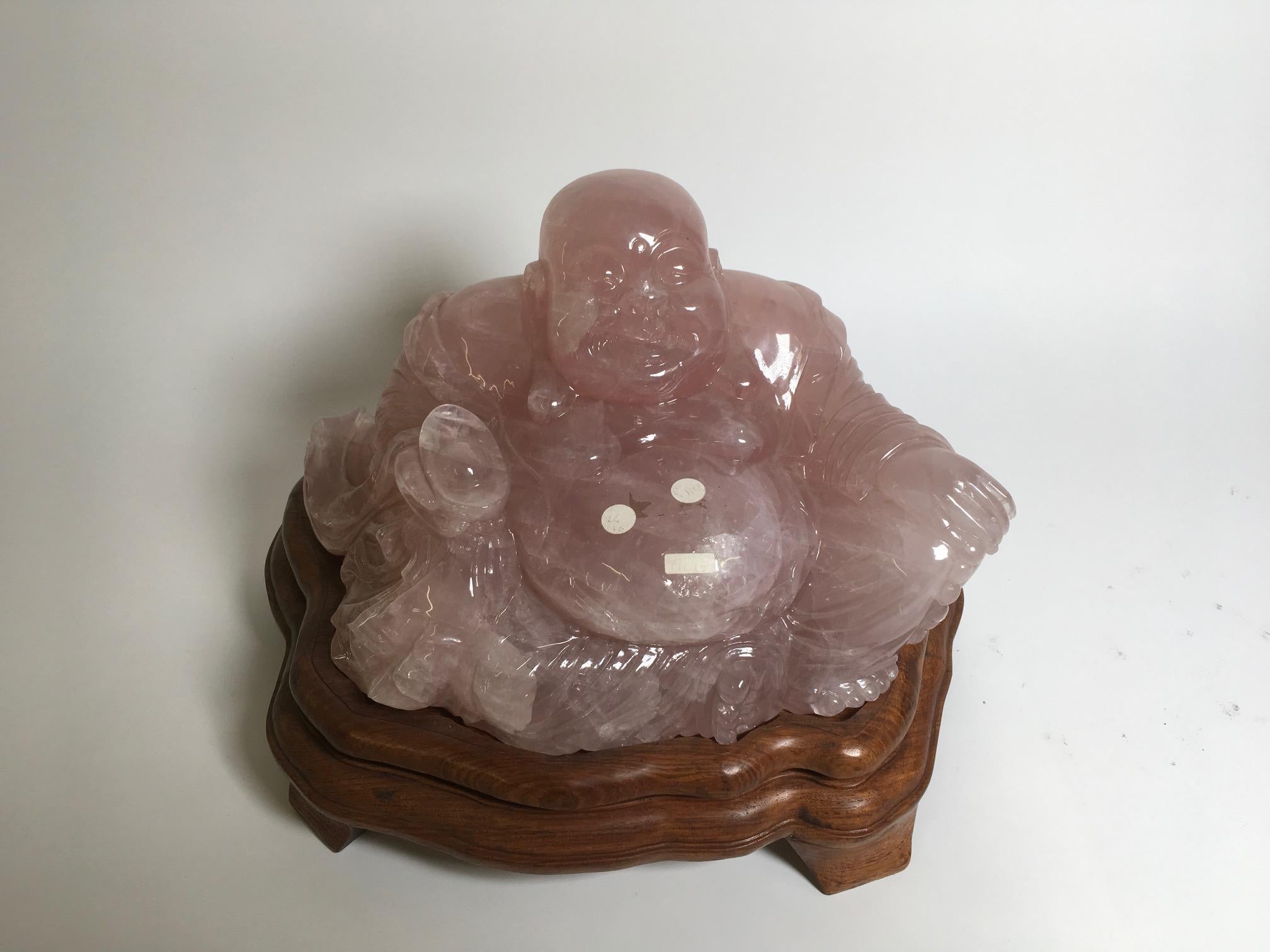 Beautiful carved rose quartz sculpture with wooden base produced in China. Italian private collection.