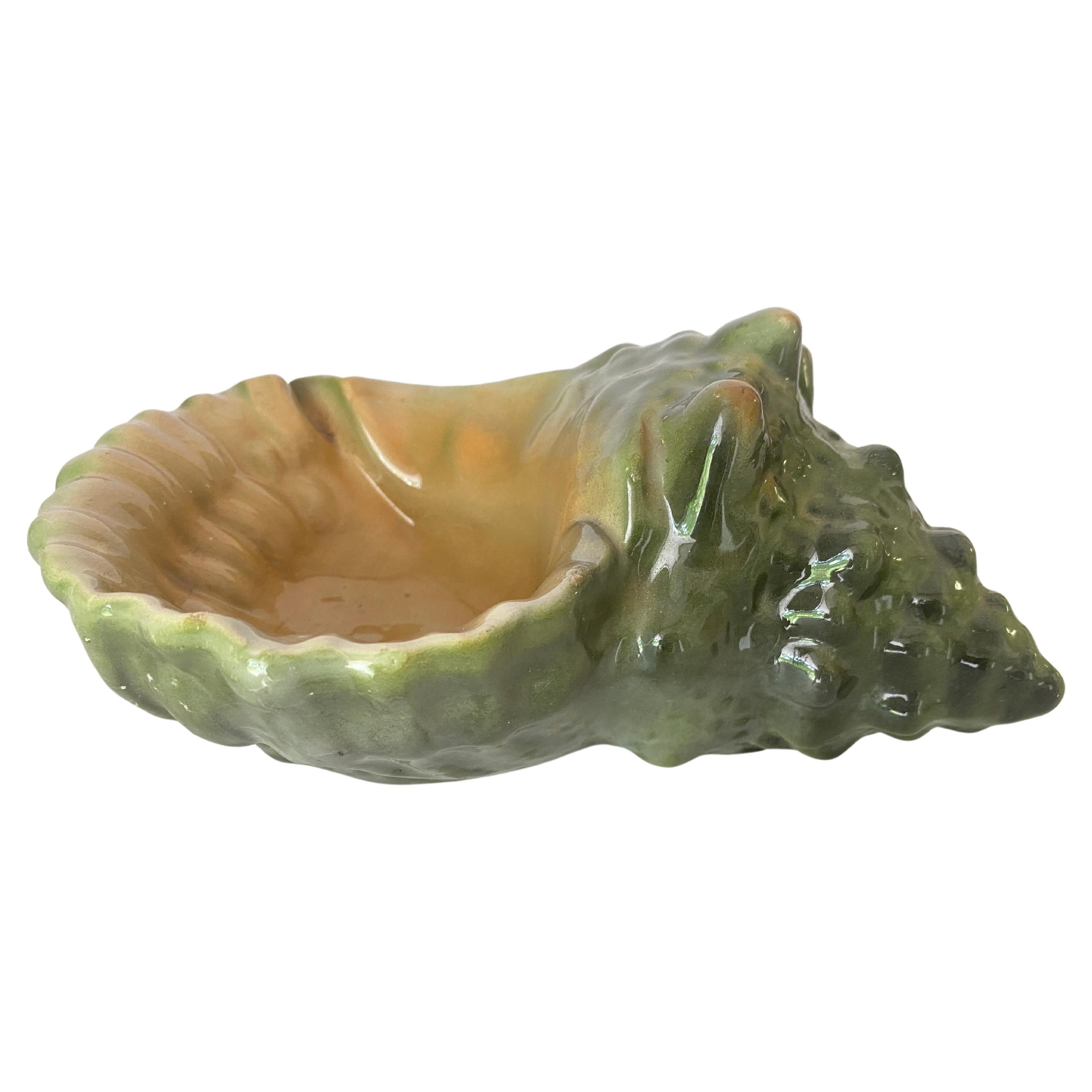 Beautiful ceramic shell ashtray, the finish is a nacre style finish.
Green Color made in Portugal 20 th Century.