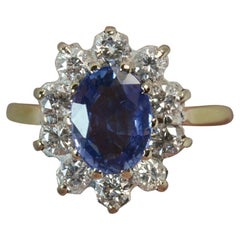 Beautiful Ceylon Sapphire and 0.60 Carat Diamond 18 Carat Gold Cluster Ring Beautiful Ceylon Sapphire and 0.60 Carat Diamond 18 Carat Gold Cluster Ring