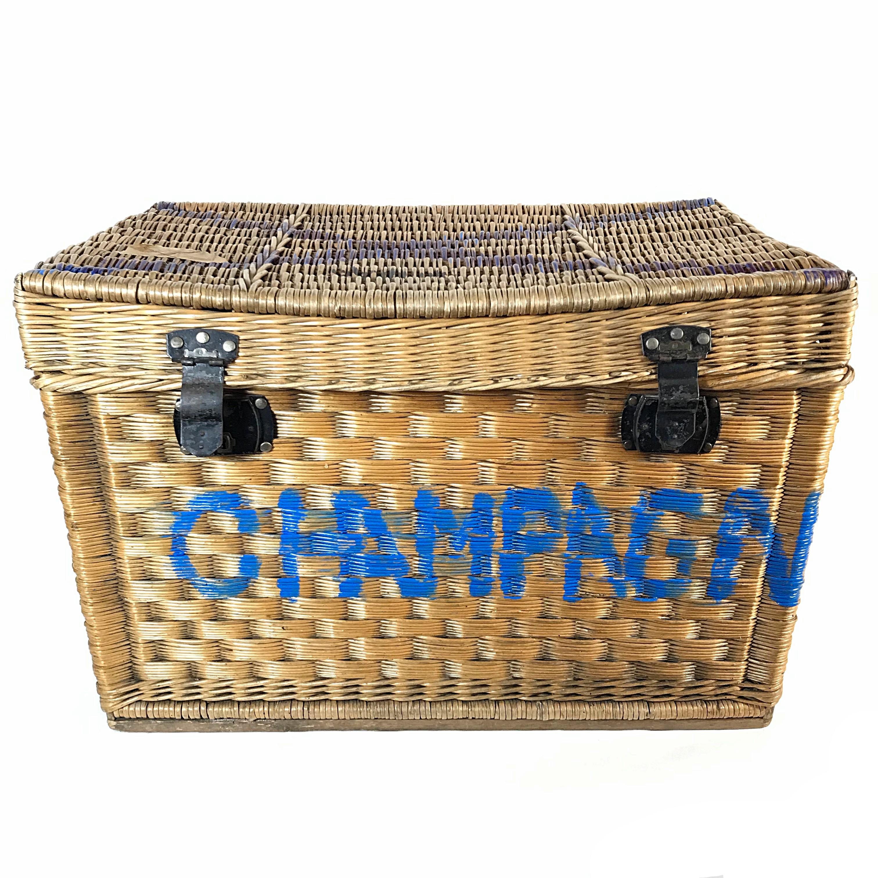 Early unique wicker trunk handmade in France in 1910s. The woven willow wicker trunk has a lid with two locks and two handles. The trunk is in very good condition with nice patina. It was used as a champagne bottle chest.

Measures: 
H 59 cm /
