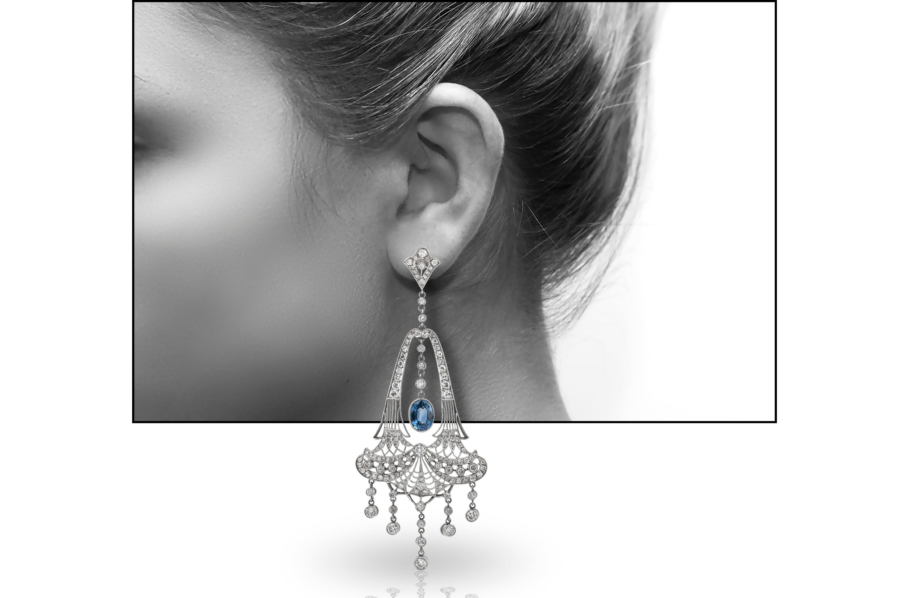 Chandelier drop earrings finely crafted in platinum.
Total diamond weight is approximately 5.00 CT.
The two center sapphire weighs an approximate 6.70 CT.
Gorgeous elegant statement earrings!