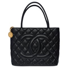 Used Beautiful Chanel Medaillon Tote bag in black caviar leather, GHW