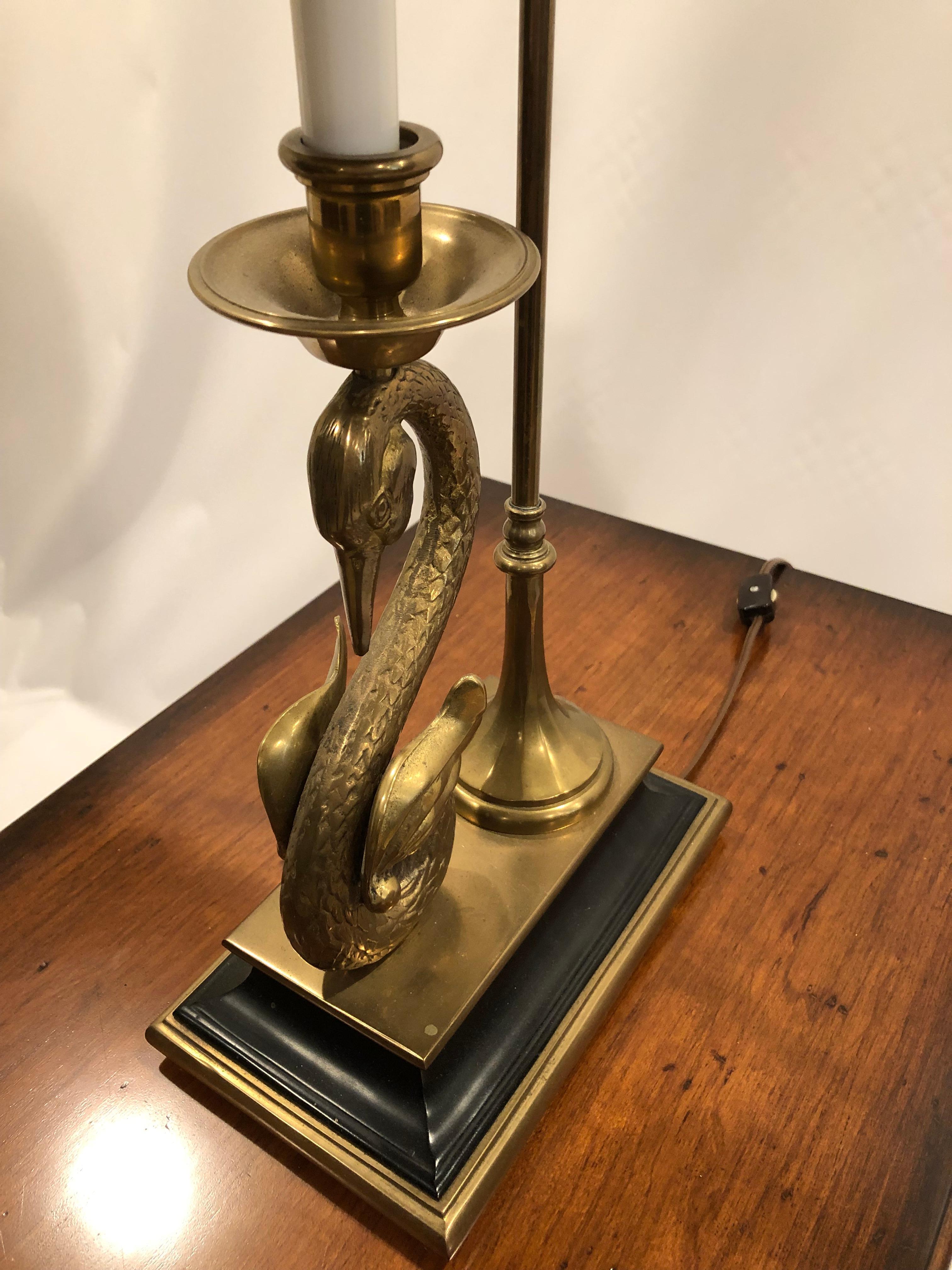 Beautiful classy Chapman table lamp having a brass swan sculptural form on black stand and quirky shaped metal lamp shade.