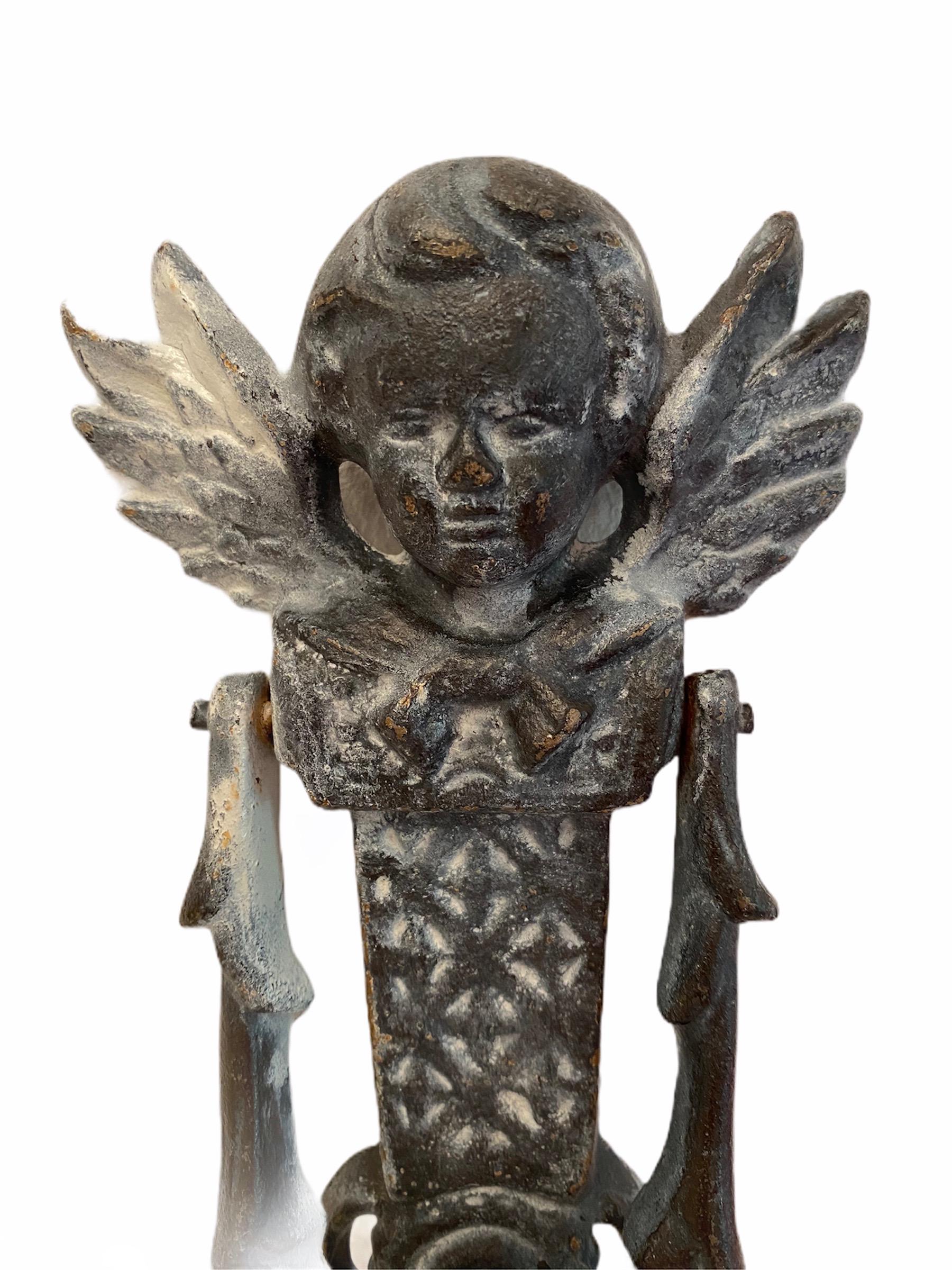 Classic 19th century German cherub angel head door knocker, made of heavy metal (maybe cast iron). Nice addition to your front door. Found at an estate sale in Germany. It is not marked.