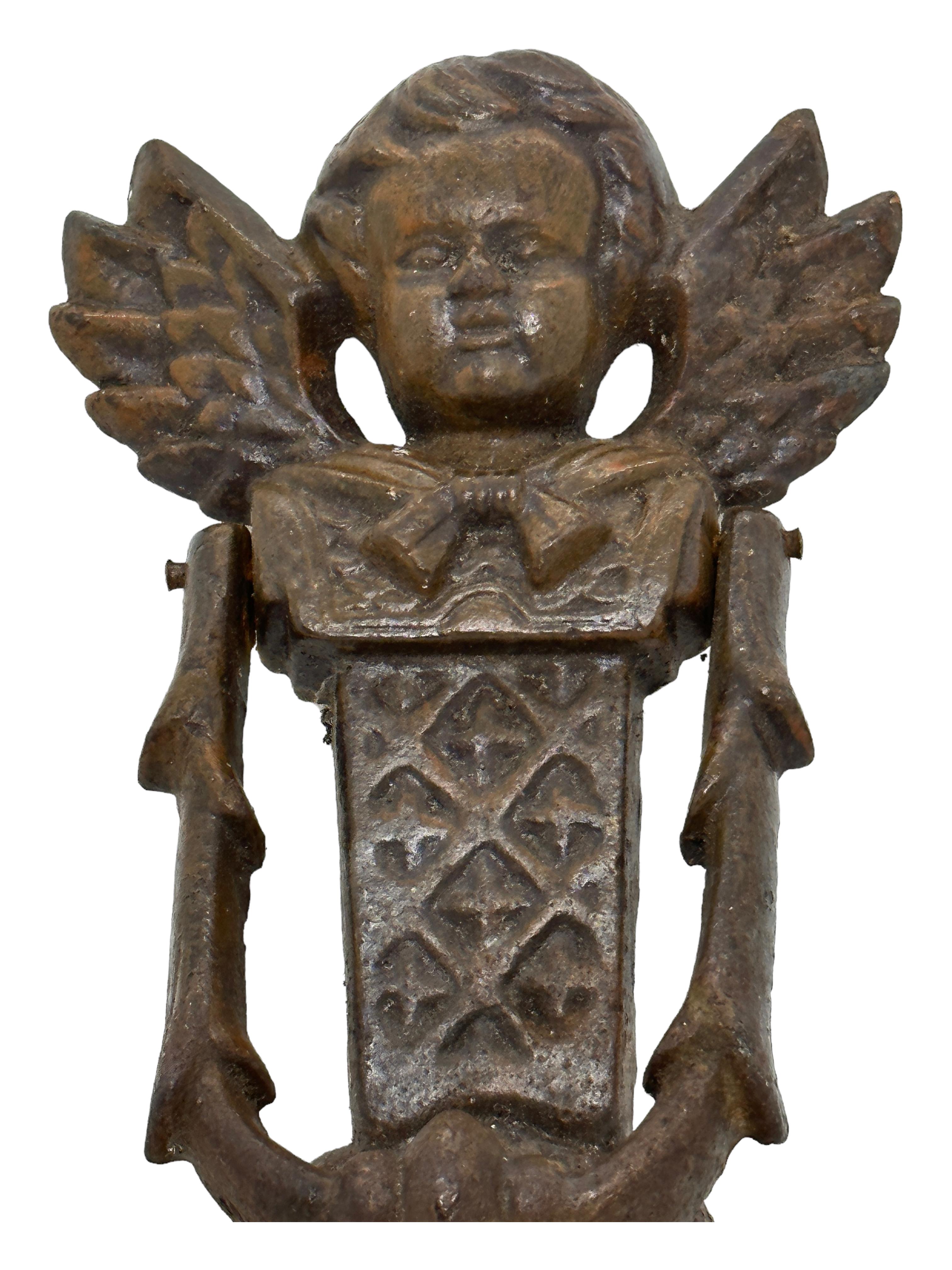 Classic 19th century German cherub angel head door knocker, made of heavy metal (maybe cast iron). Nice addition to your front door. Found at an estate sale in Germany. It is not marked.