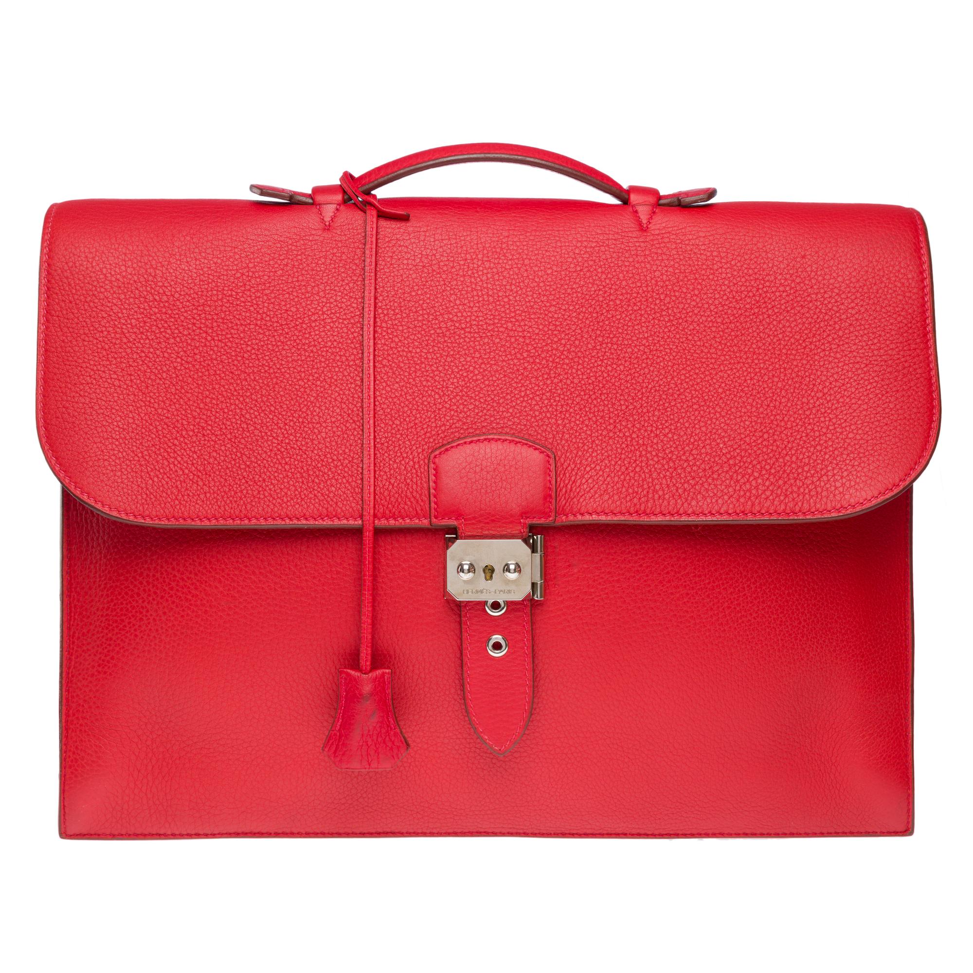 Splendid​ ​and​ ​very​ ​chic​ ​Hermès​ ​Briefcase​ ​Togo​ ​leather​ ​bag​ ​red,​ ​metal​ ​palladium​ ​silver​ ​trim,​ ​simple​ ​handle​ ​in​ ​red​ ​leather​ ​allowing​ ​a​ ​hand​ ​carry

Closing​ ​by​ ​flap-mounted​ ​swing​ ​latch
Red​