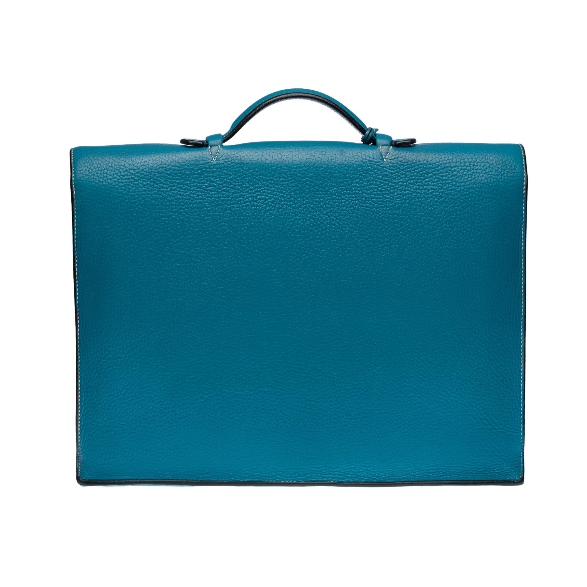 Splendid and very chic Hermès Briefcase bag in Togo blue jeans leather with white stitching, palladium silver metal hardware, simple blue leather handle allowing a hand-carried

Folding latch closure on flap
Leather/blue suede inner lining, 2
