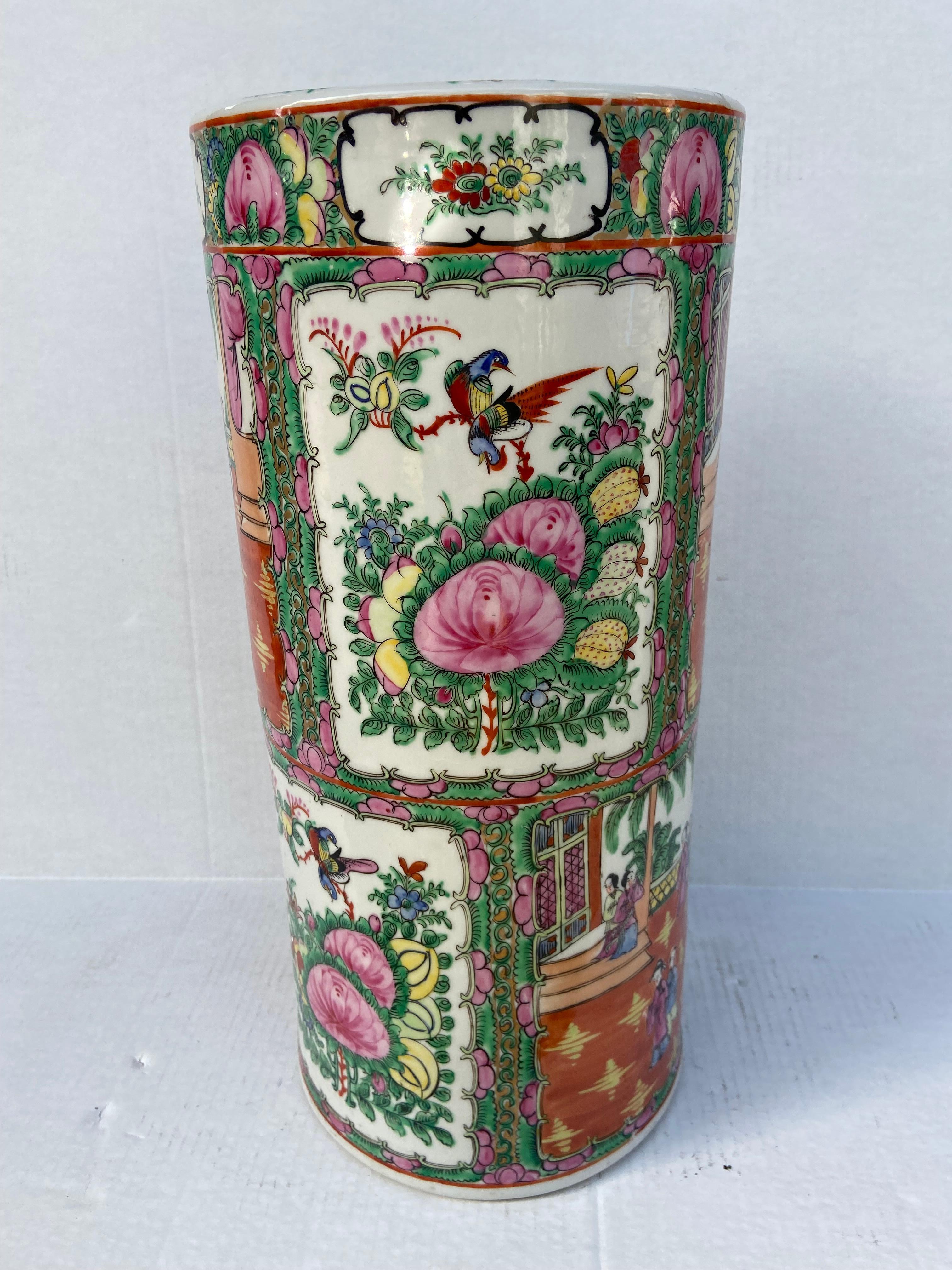 Beautiful Chinese Rose Medallion Umbrella Stand. Hand-painted with a lush and colorful design, this umbrella stand features traditional floral and narrative scenes inspired by historic artworks found in Canton Ware. A handmade porcelain umbrella
