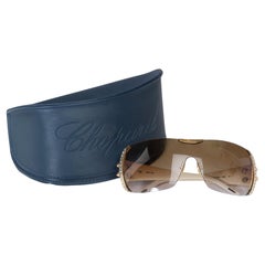 Preciosas gafas de sol Chopard, modelo máscara, montura de metal dorado