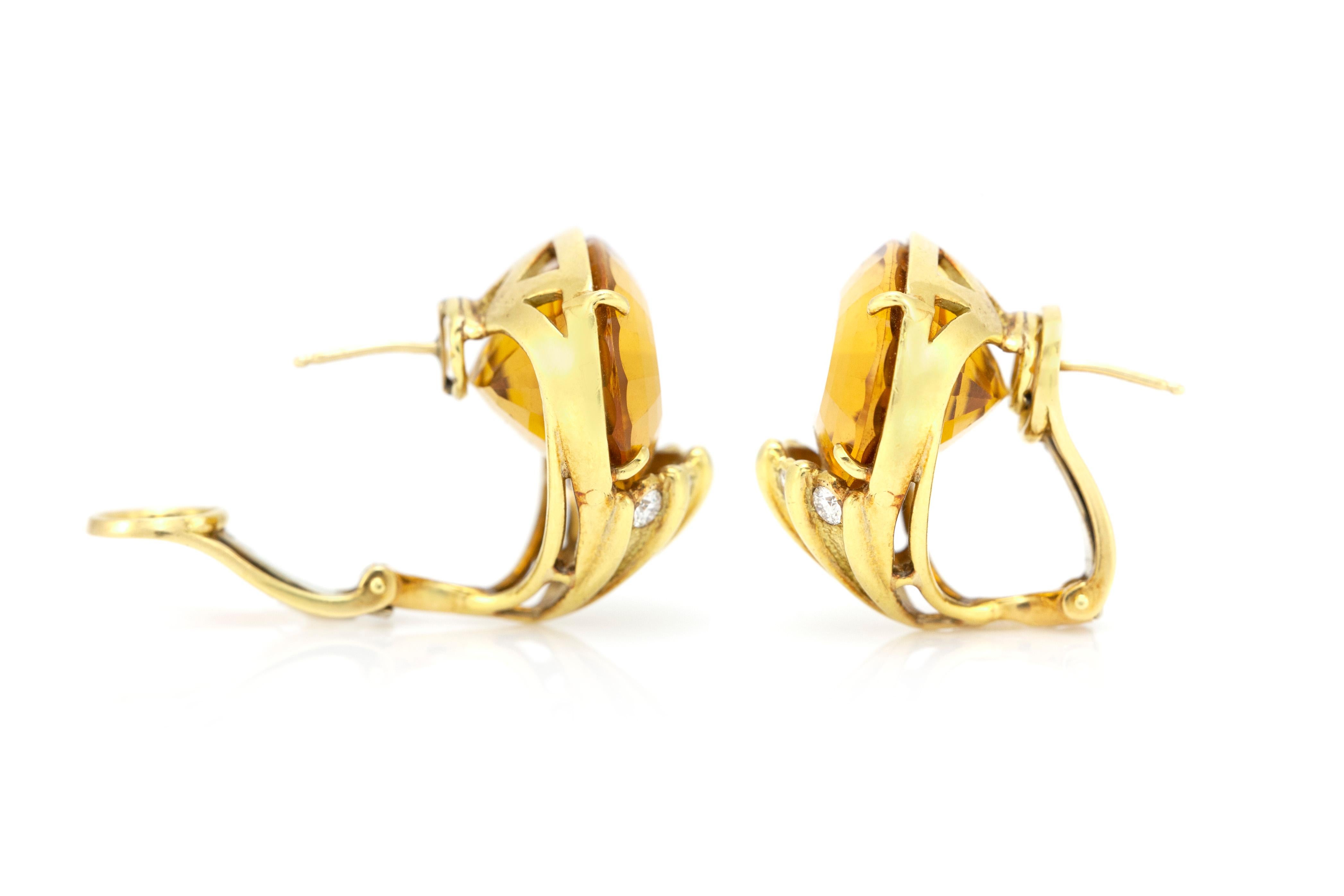 The earrings is finely crafted in 18k yellow gold with diamonds weighing approximately total of 0.50 and citrine as a center stone and weighing approximately total of 30.00 carat.