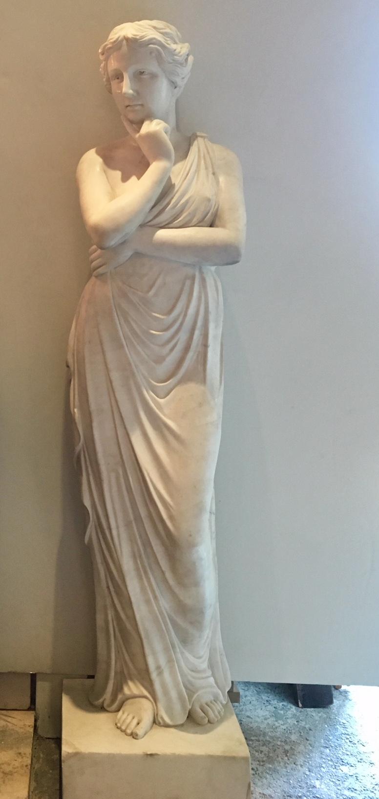 Beautiful hand-carved Venus sculpture after Greek and Roman examples. Made in Italy in the 20th century from high quality bright white Carrara marble. The sculpture is in a very good condition. 190 cm in height (including square basement), 40 cm