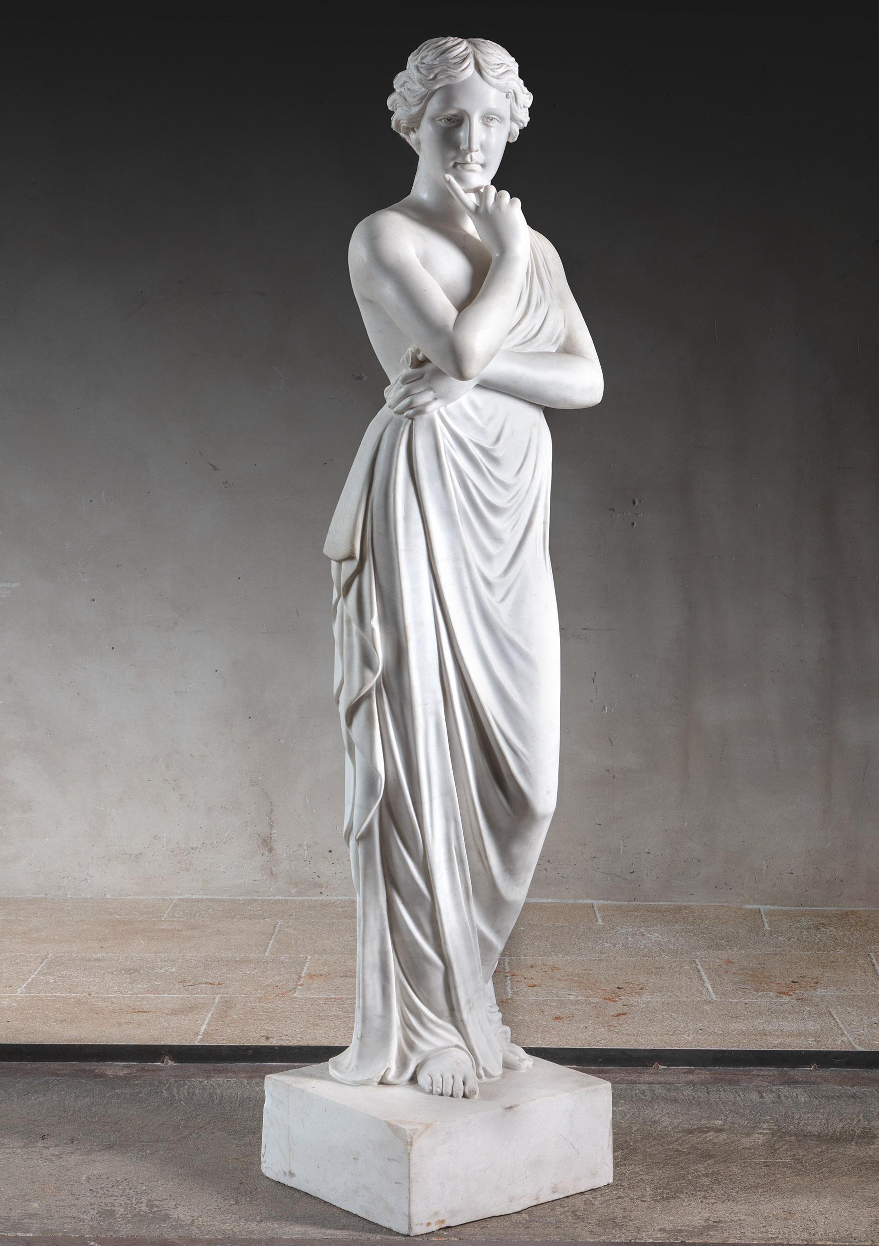 Beautiful hand carved Venus sculpture after Greek and Roman examples. Made in Italy in the 20th century from high quality bright white Carrara marble. The sculpture is in a very good condition. Measures: 190 cm in height (including square basement),