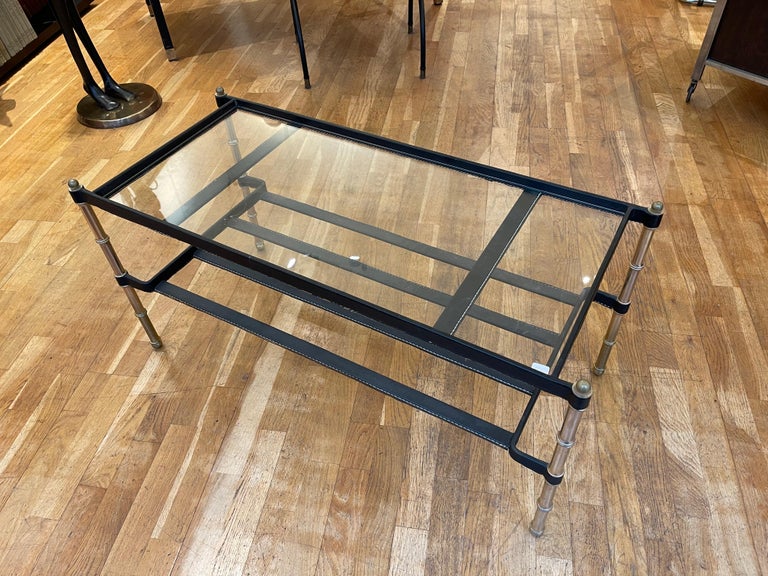 Coffee table by famous French designer Jacques Adnet (1900-1984). It is a typical creation of Adnet from the early 1950's using 'Piqué Sellier