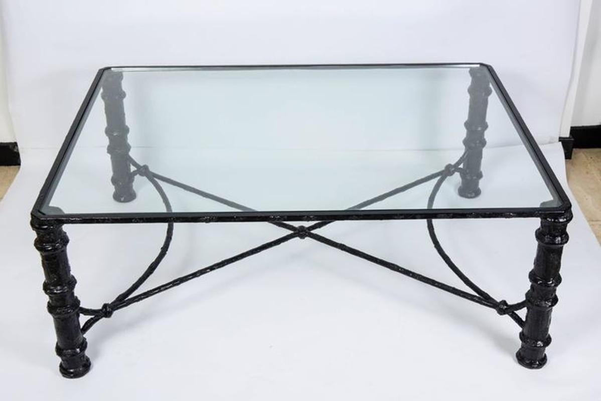 Darkened metal coffee table and patina in light relief. in the taste of Diego Giacometti
Top in clear glass,
circa 1950.