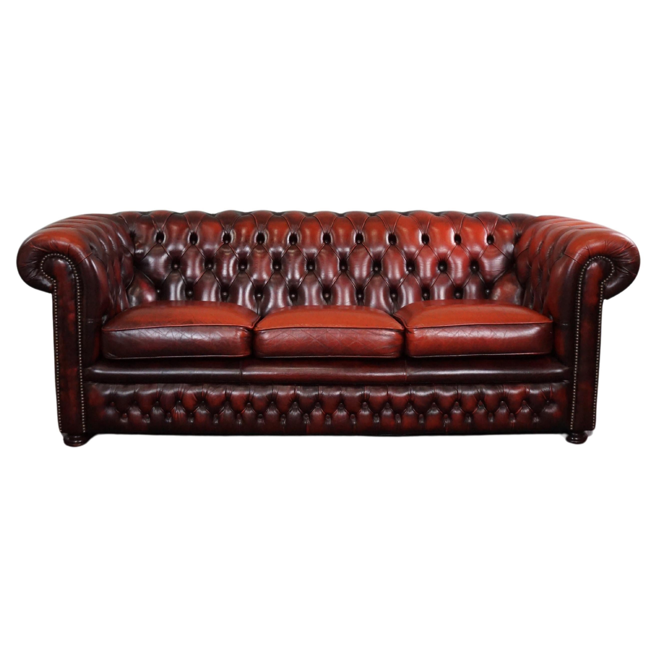 Beautiful colored red spacious cow leather Chesterfield sofa, 2.5 seater For Sale