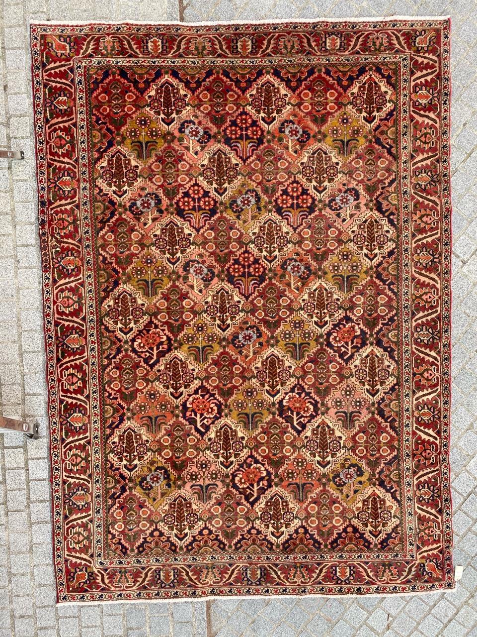 Discover the elegance of our exquisite midcentury rug featuring a captivating design and vibrant colors, including red, blue, yellow, green, pink, and orange. This hand-knotted masterpiece showcases meticulous craftsmanship with wool velvet on a