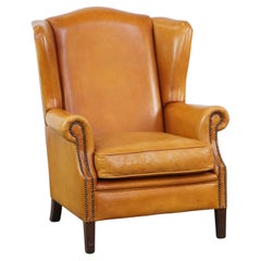 Beautiful, comfortable, and  luxurious leather wingback chair in good condition