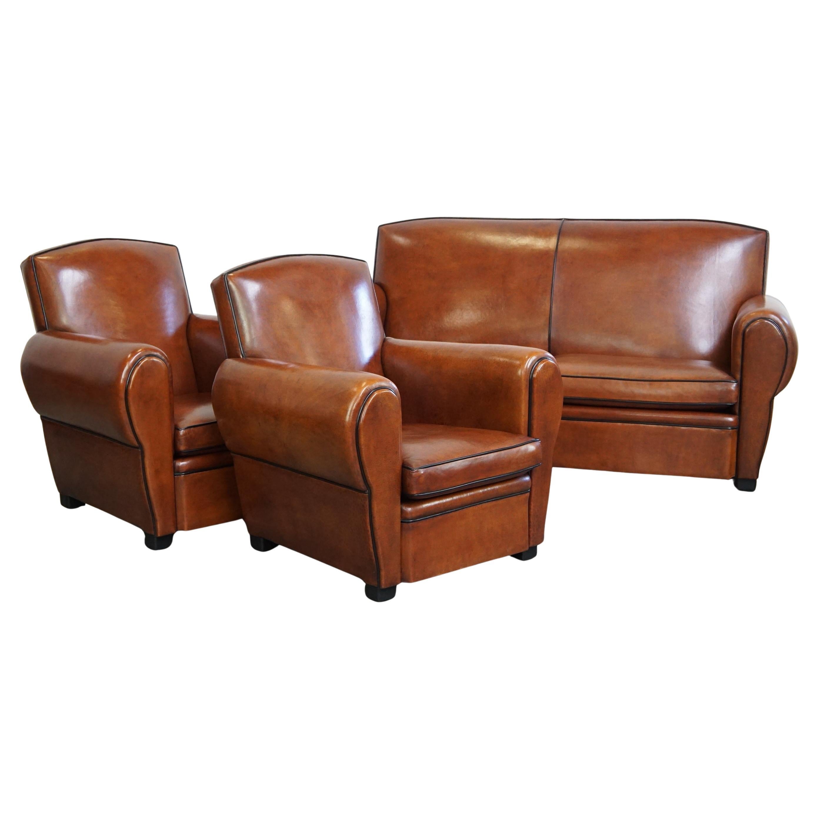 Magnifique ensemble complet composé d'un canapé en cuir de mouton et de deux fauteuils