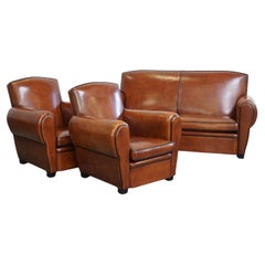 Precioso conjunto completo compuesto por un sofá de piel de cordero y dos sillones