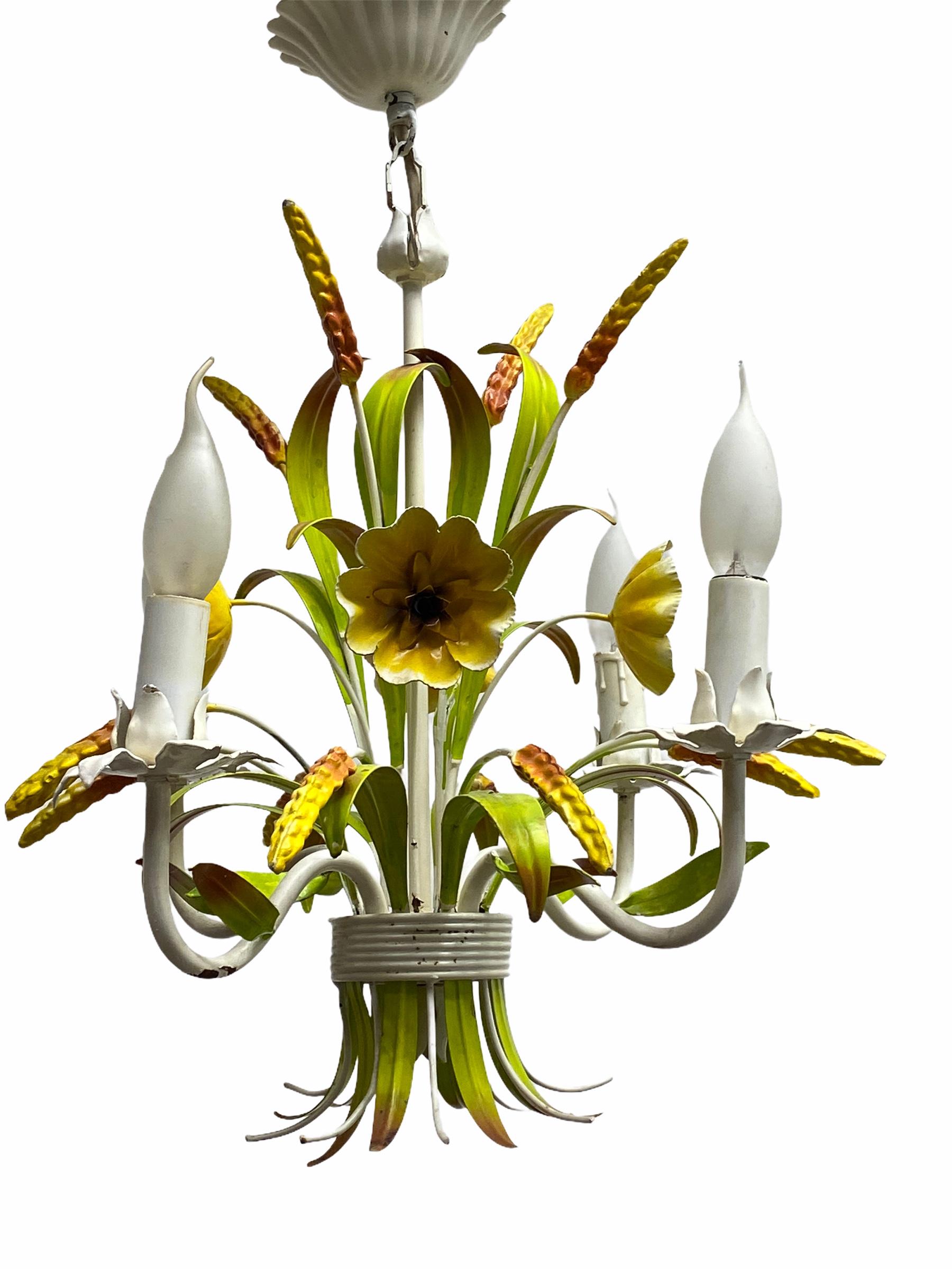 Petite Florentine style four-light chandelier. Functions as is with four E14 / 110 volt light bulbs. Can take up to 40 watts each bulb. Beautiful colored metal chandelier.
It gives the room a beautiful warm light and shows the French country or