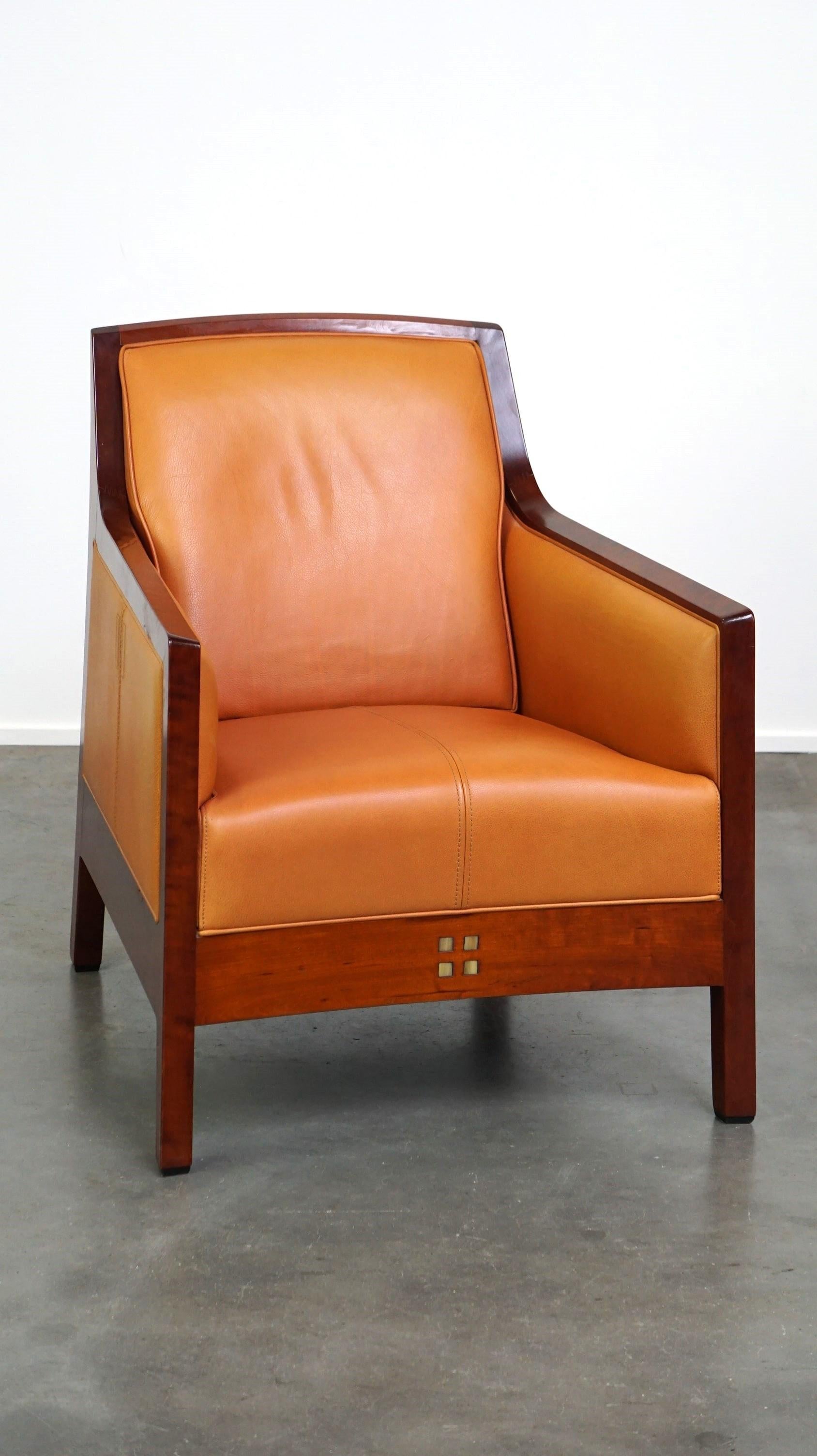 Hand-Crafted Beautiful cow leather Artdeco design armchair. High comfort and unique details For Sale