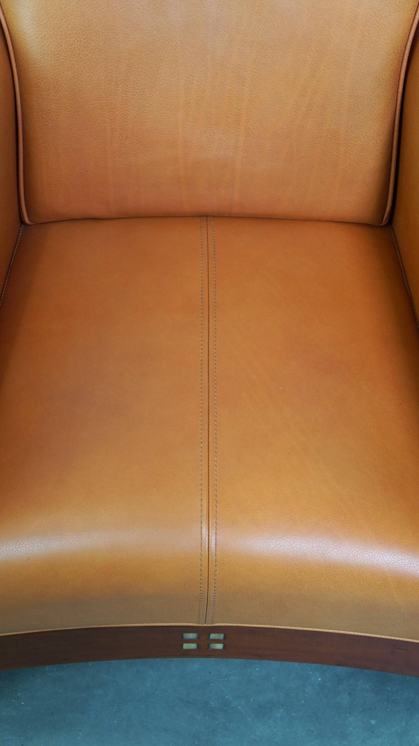Beautiful cow leather Artdeco design armchair. High comfort and unique details For Sale 2