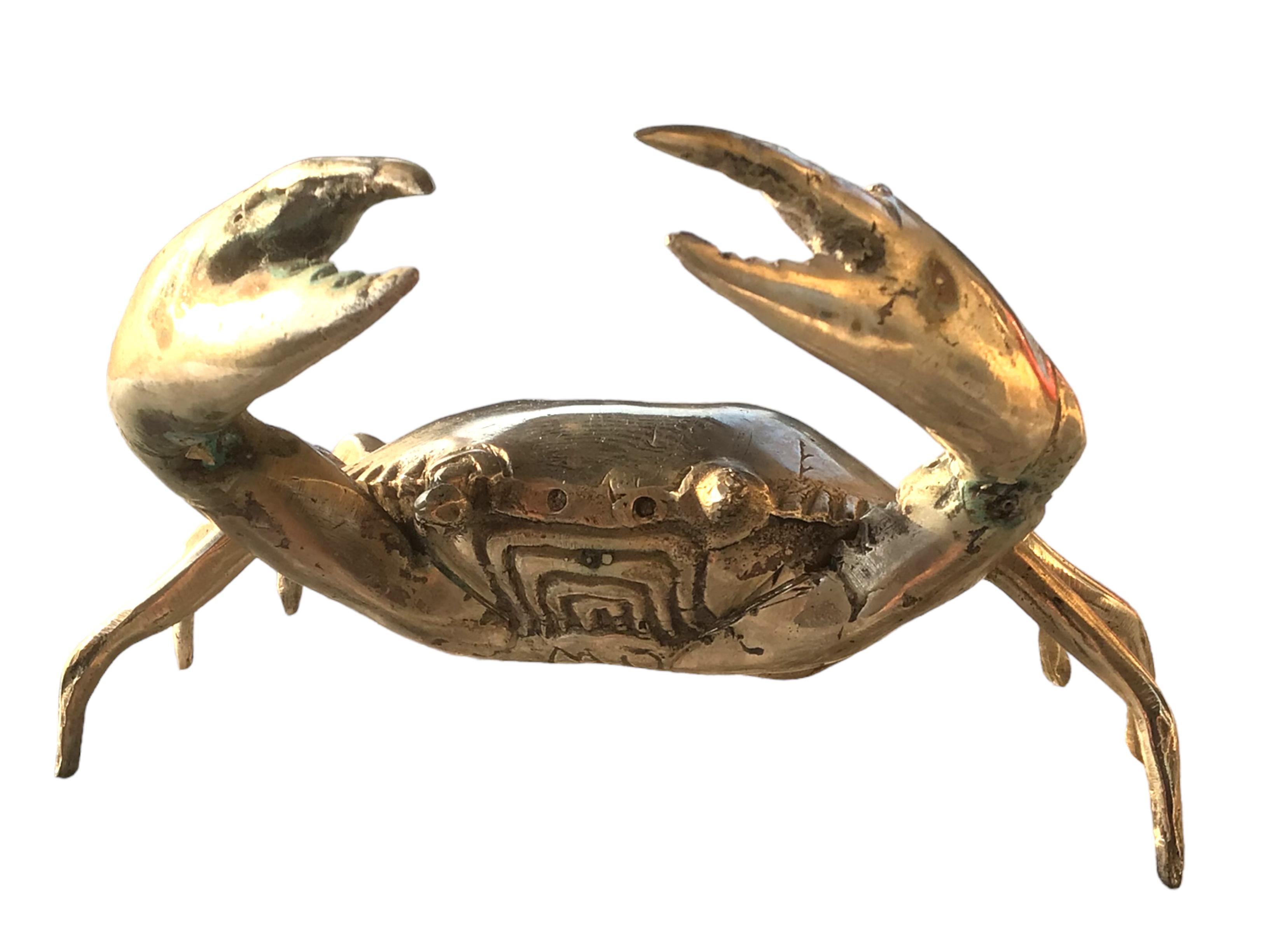 This nickel plated metal crab statue was most likely made in the 1980s in Italy. Can not tell the maker or the artist, but it is signed MD. This particular crab statue is a beautiful piece, it can be displayed as a sculptural focal point on a
