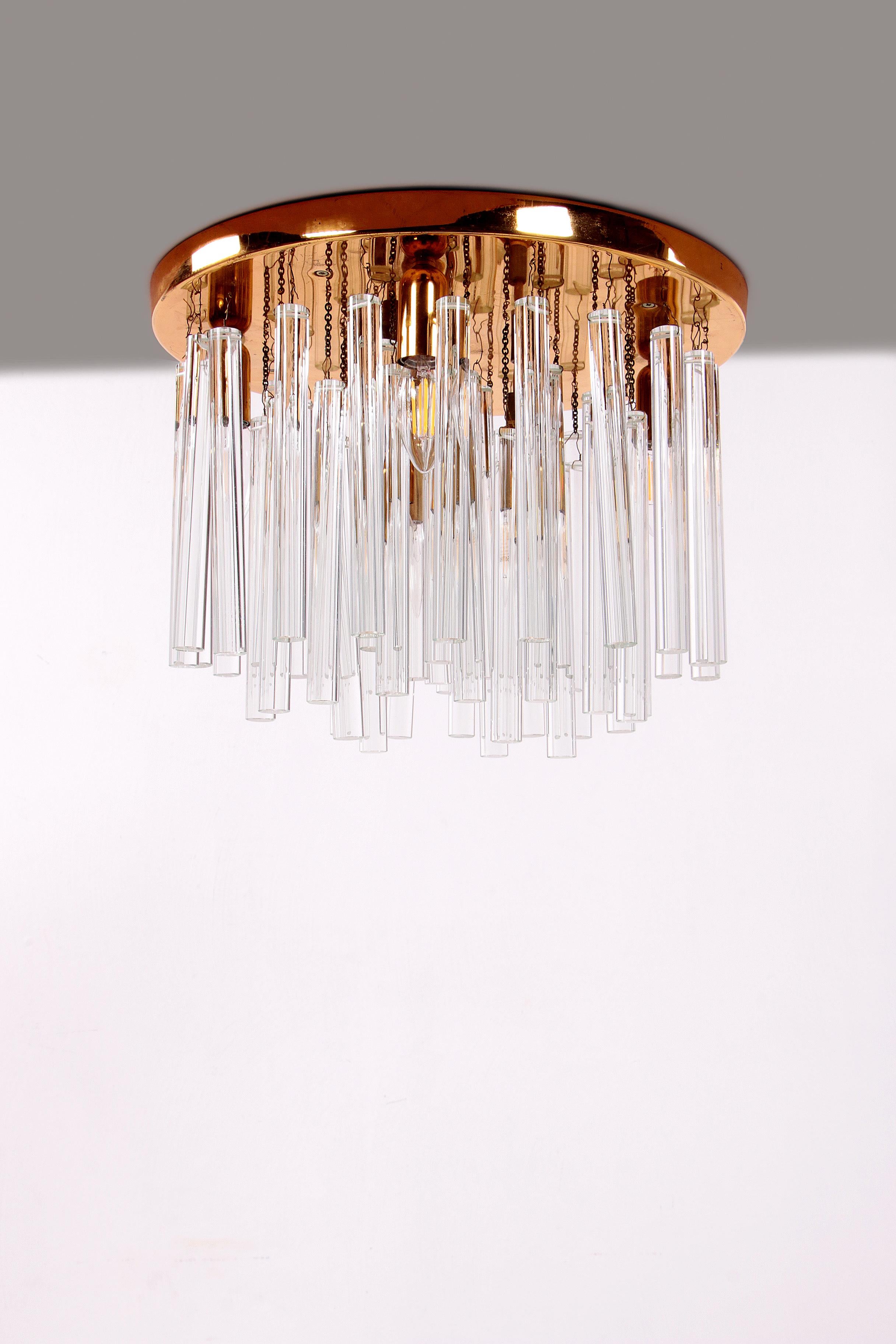 Beautiful crystal chandelier or ceiling lamp 1960, Germany
This beautiful ceiling lamp has 53 glass rods, some on a chain and others on a hook. The plate is made of brass, there are signs of wear on this plate, but you don't see that when the lamp