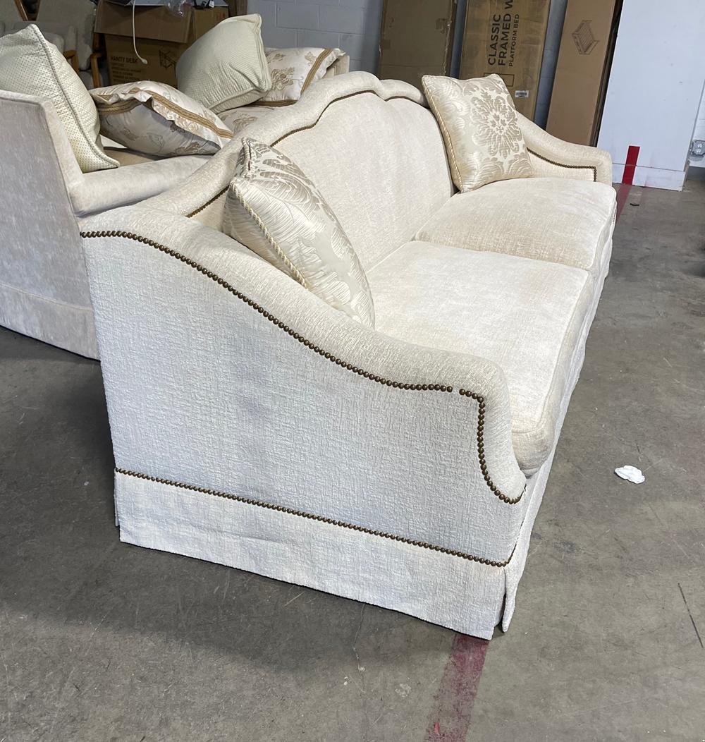 Beautiful custom made sofa upholstered in a cream fabric, solidly built and very comfortable.

The sofa can easily seat 4 people, the curved arms look stunning and the metal studs really stand out.

Measurements:

109 inches wide 39 inches